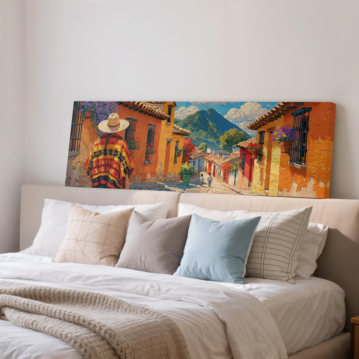 Colorful Guatemalan street with volcano view wide panoramic canvas print above a bed in a bedroom