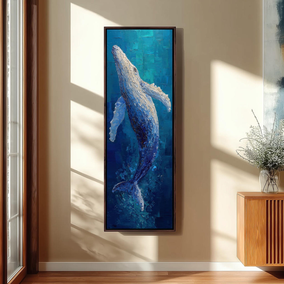 a large painting of a blue whale hanging on a wall in a modern kitchen.