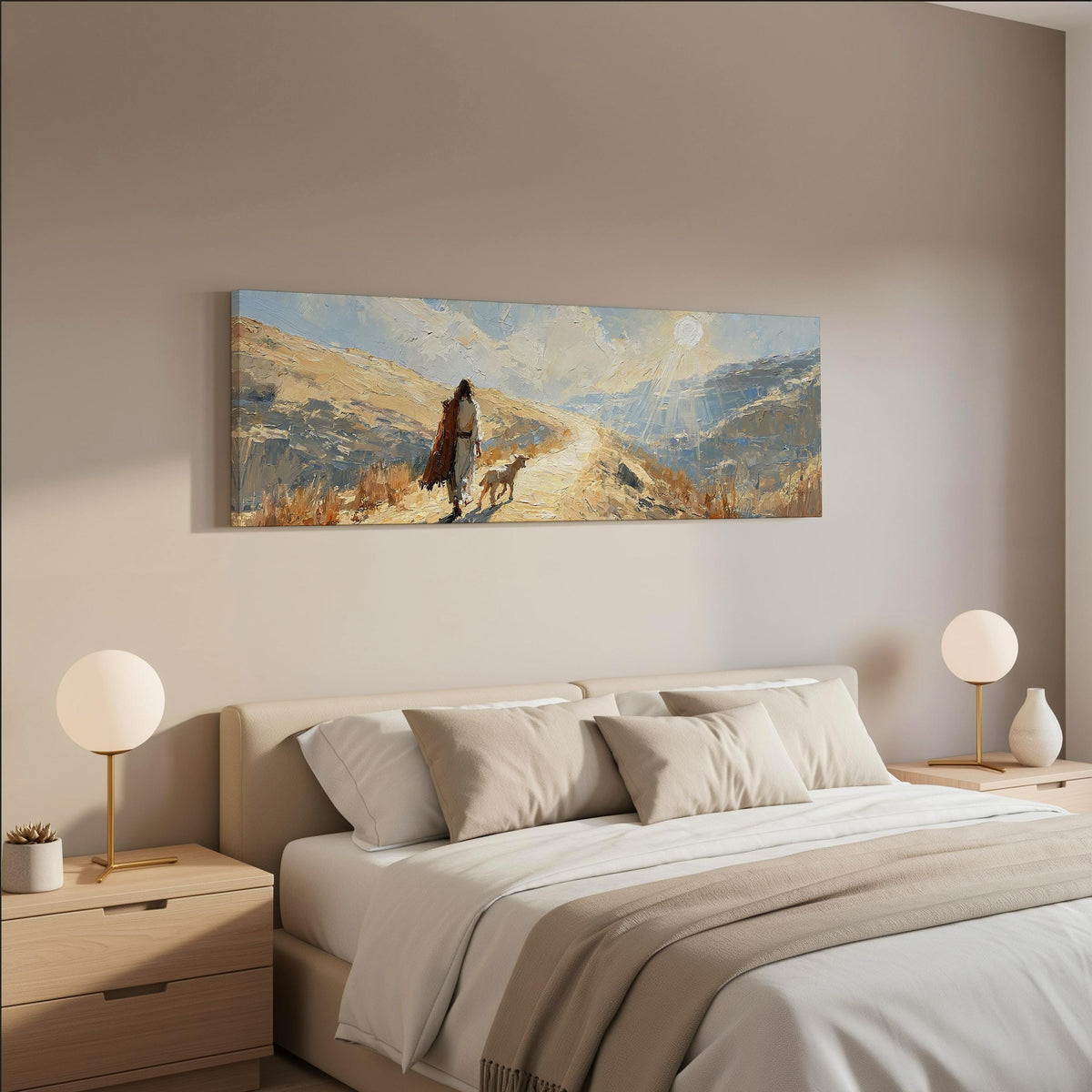 Jesus walking a sunlit hillside path with a sheep wide panoramic canvas print above a bed in a neutral bedroom