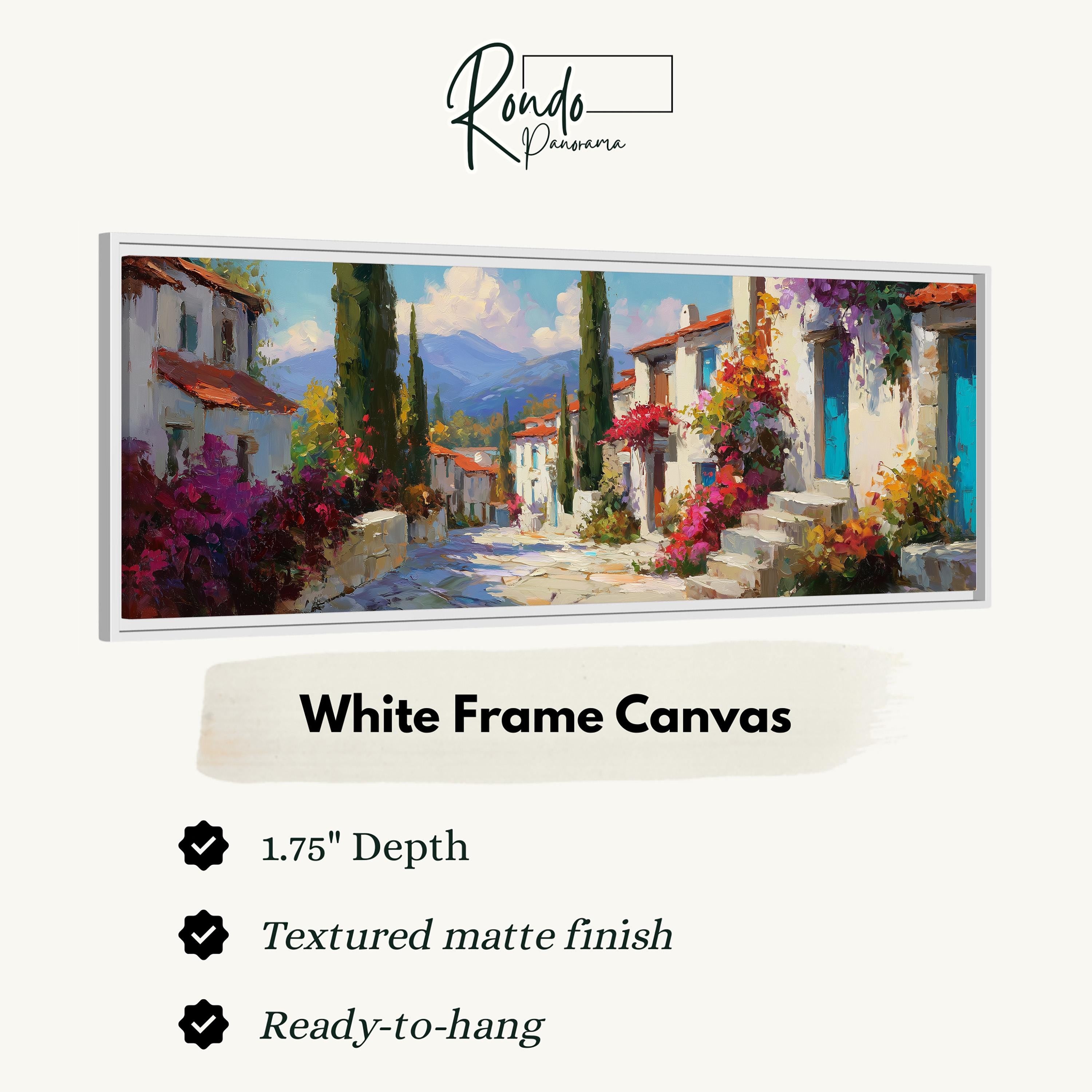 The image is a white frame canvas depicting a picturesque village scene with colorful buildings, a winding road, and a backdrop of mountains.