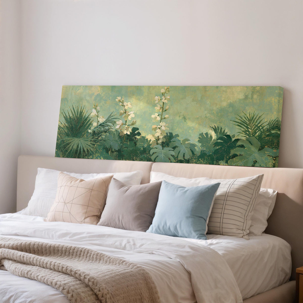 Tropical white blooms in green foliage wide panoramic canvas print above a bed in a bedroom