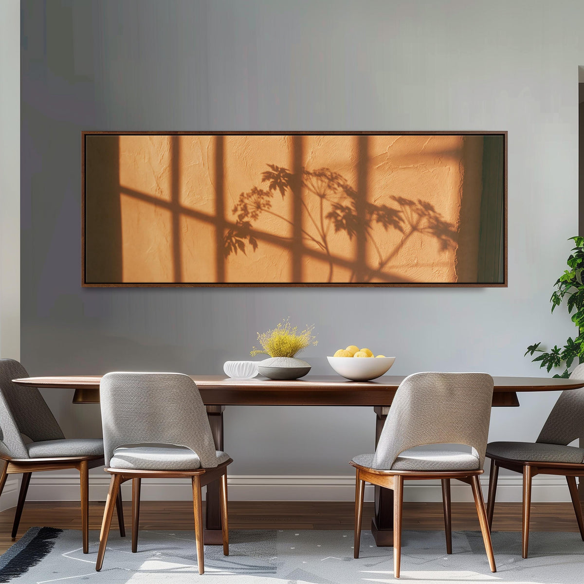 Plant and window shadows on a terracotta wall long horizontal canvas print above a dining table