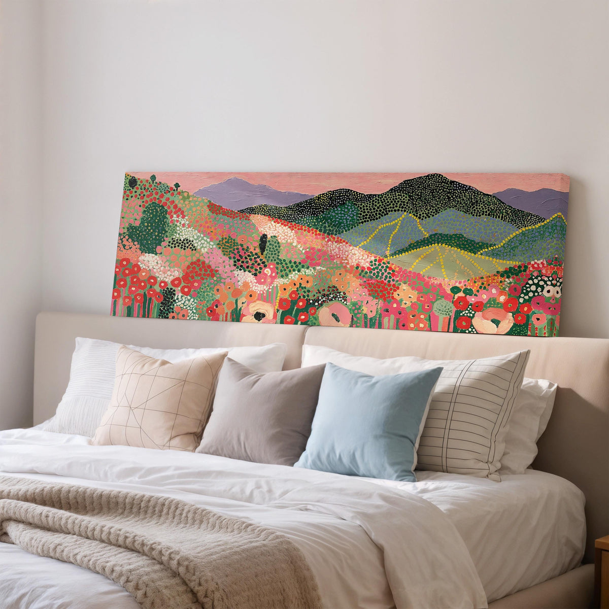 Dotted poppy mountains under a pink sky wide panoramic canvas print above a bed in a bedroom