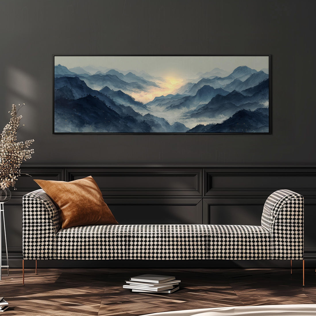 a large, framed landscape painting hanging on a wall above a black and white checkered sofa with a brown throw pillow.