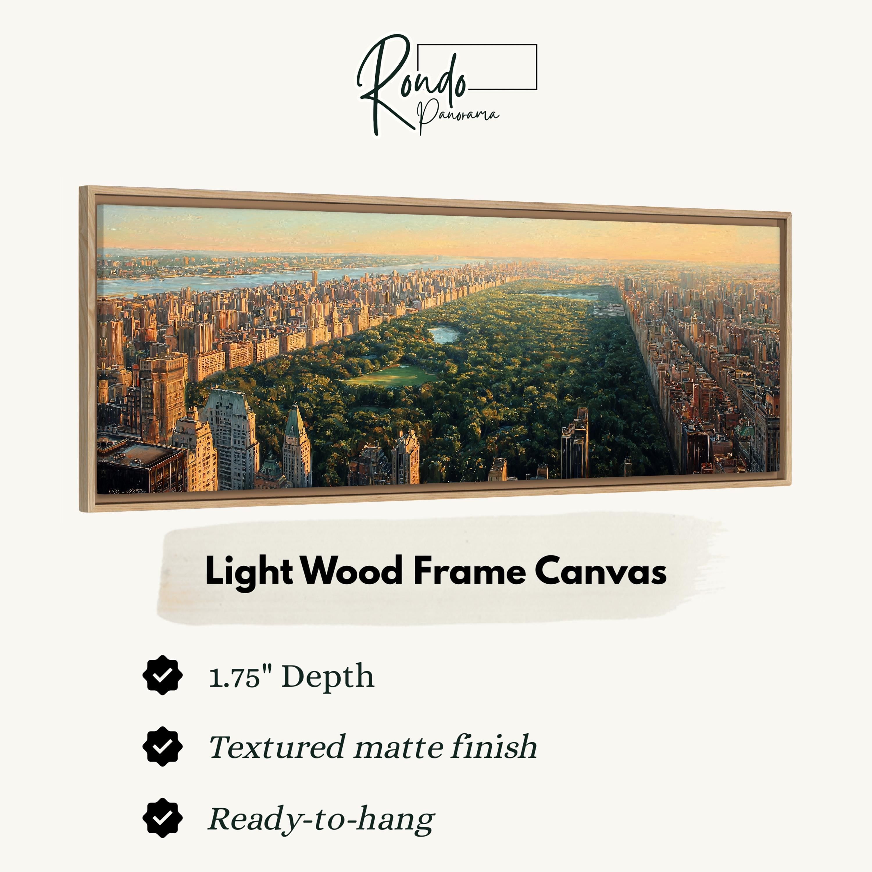 A large, light wood frame canvas depicting a cityscape with tall buildings and a park in the distance.