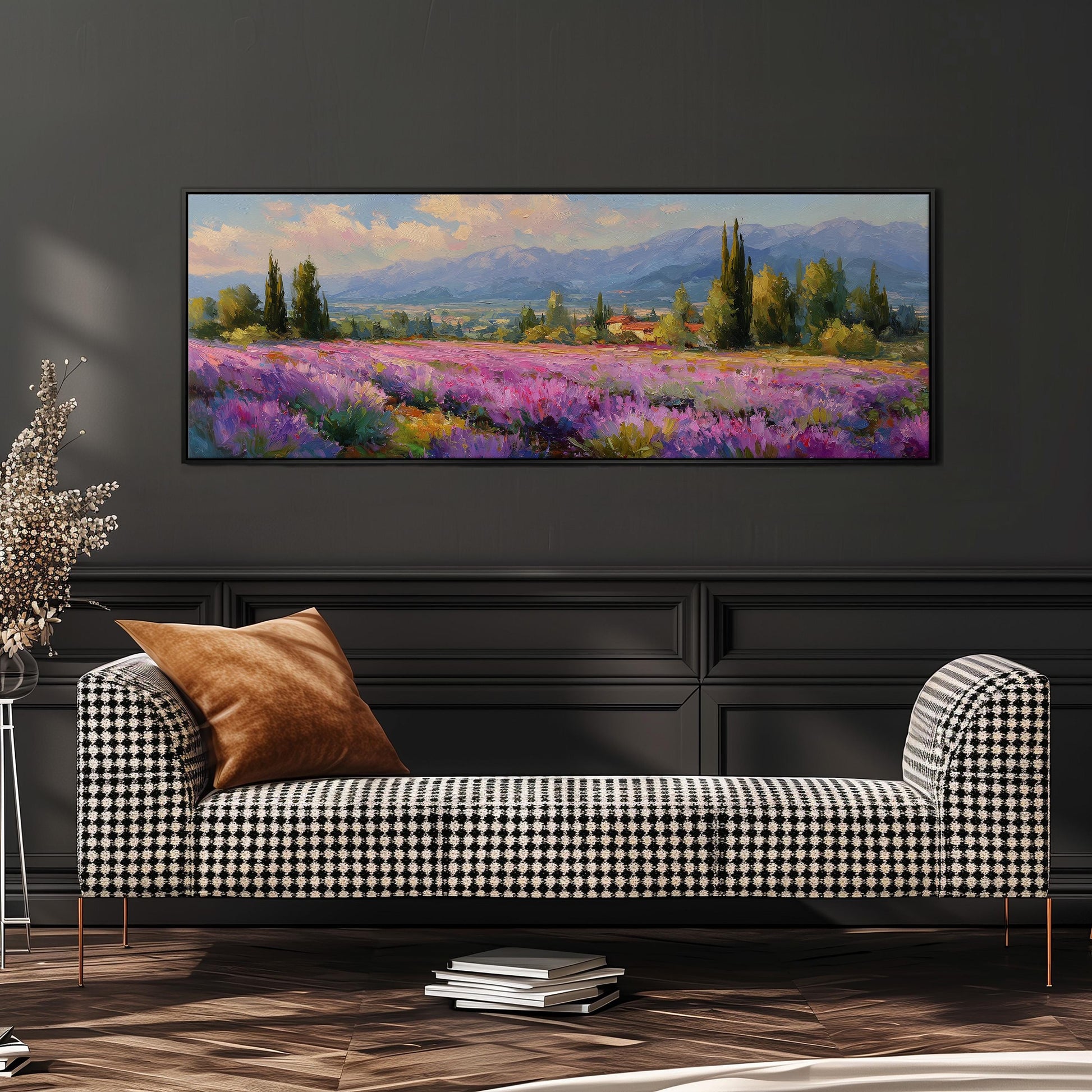 a large painting of a field of purple flowers hanging on a wall above a black and white checkered sofa.