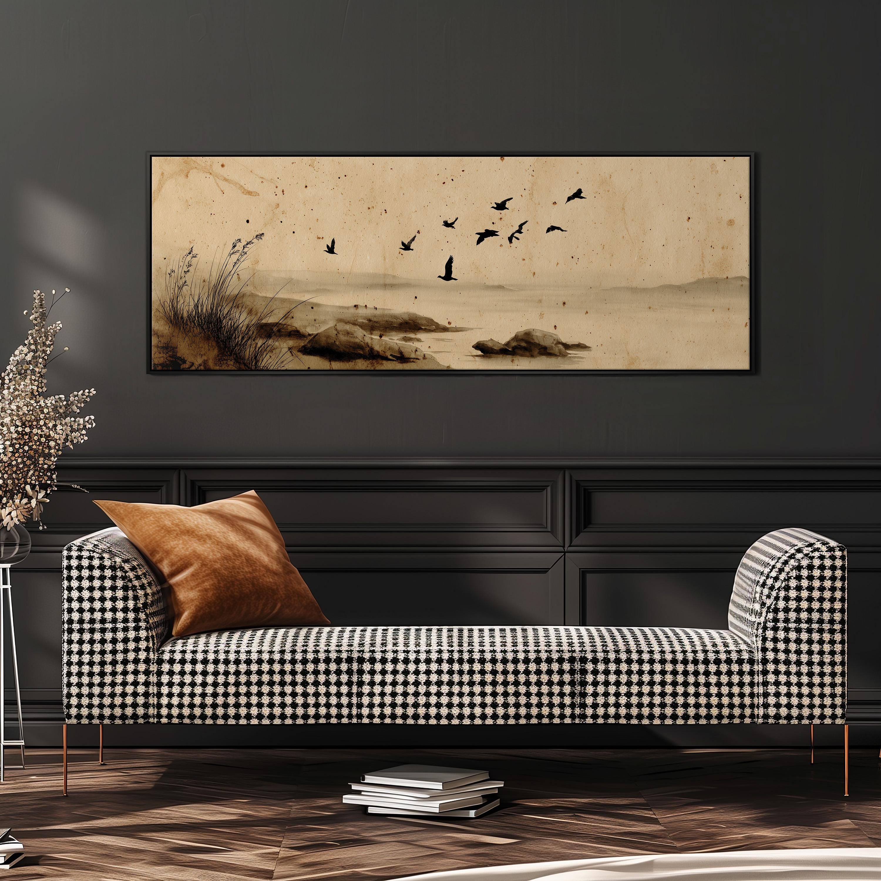 a black and white checkered sofa with a brown throw pillow, set against a dark wall with a framed painting of birds in flight above it.