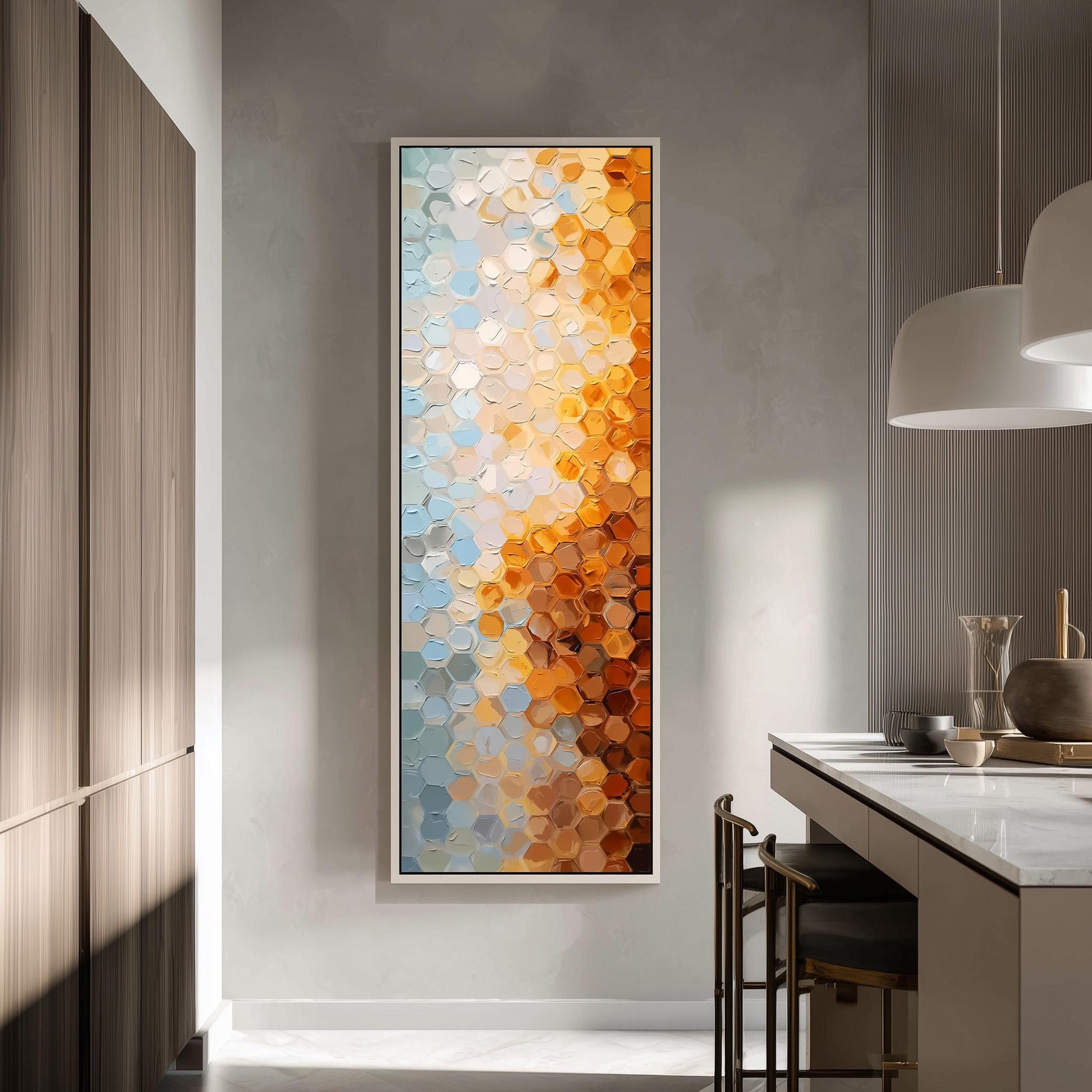 a modern kitchen with a large abstract painting hanging on the wall. The painting has a vibrant color palette of orange, blue, and white hexagonal shapes, creating a visually striking contrast against the neutral tones of the kitchen.