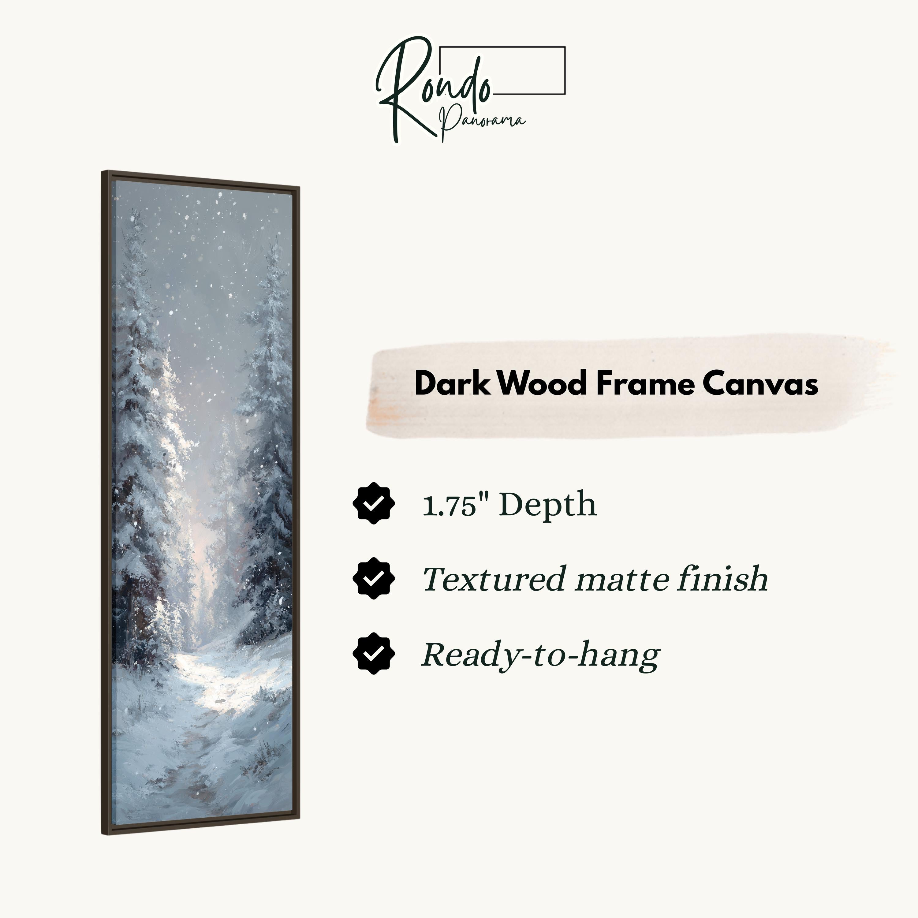 The image is a rectangular dark wood frame canvas depicting a snowy winter scene with snow-covered trees.