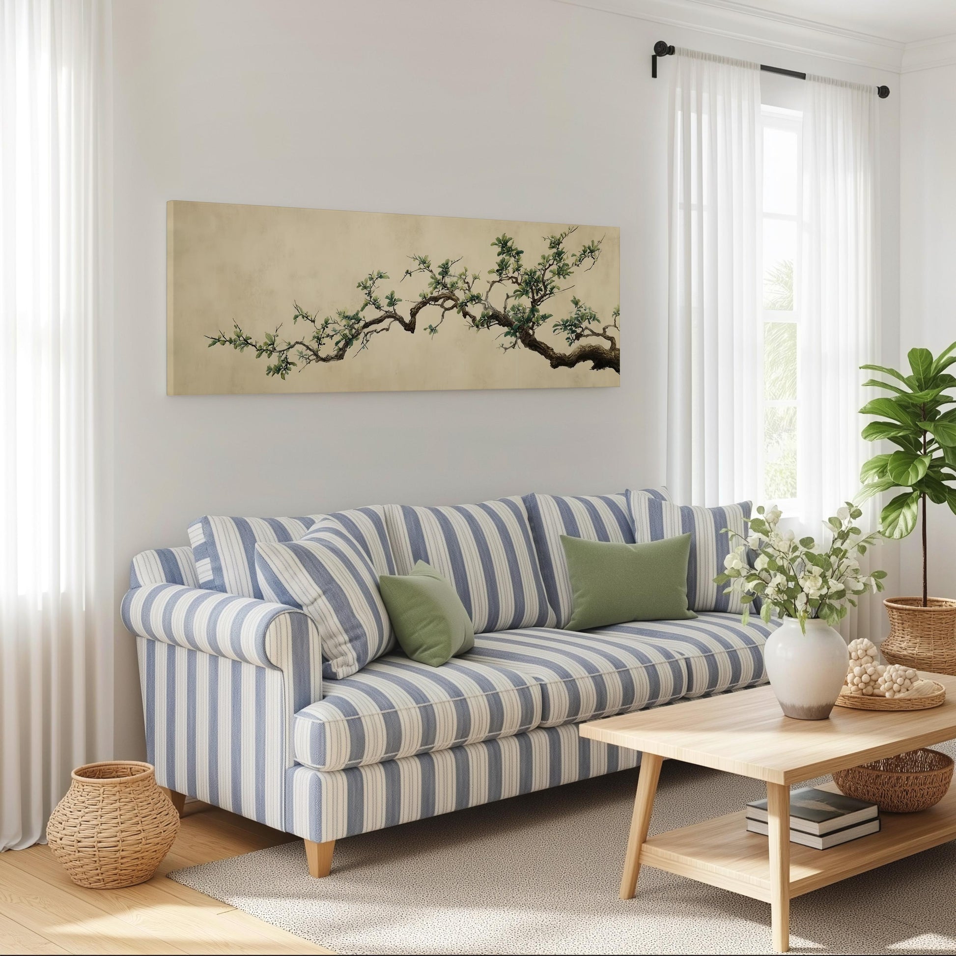 a cozy living room with a striped blue and white sofa, a wooden coffee table, and a large window with white curtains. A painting of a tree branch is displayed on the wall above the sofa, and a potted plant is placed on the coffee table.