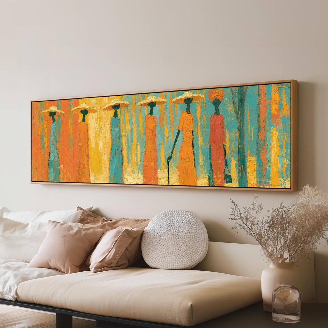 Procession of figures in amber and teal long horizontal canvas print above a sofa in a living room