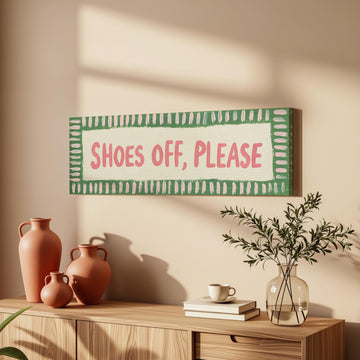Shoes off, please sign long horizontal canvas print above a sofa in a living room