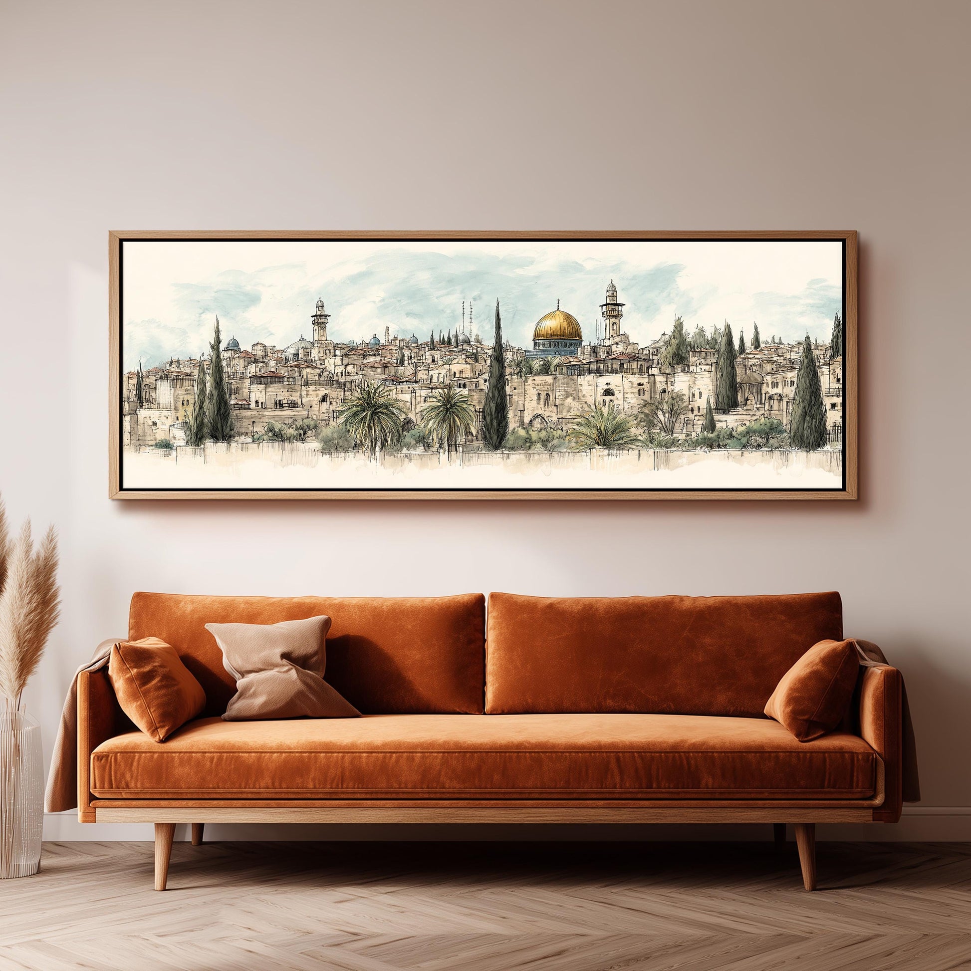 a large, framed painting of a cityscape with a prominent dome in the center, hanging on a wall above a brown sofa.