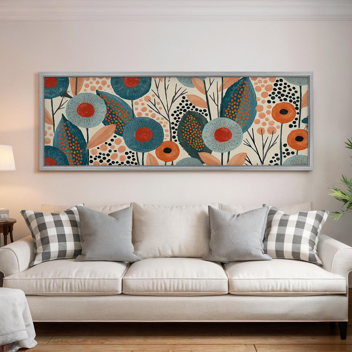 Teal poppies and speckled leaves panoramic canvas print above a white sofa in a bright living room