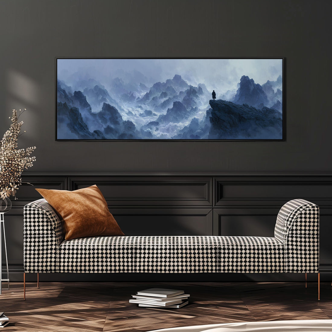 a large, framed painting of a mountainous landscape hanging on a wall above a black and white checkered sofa.