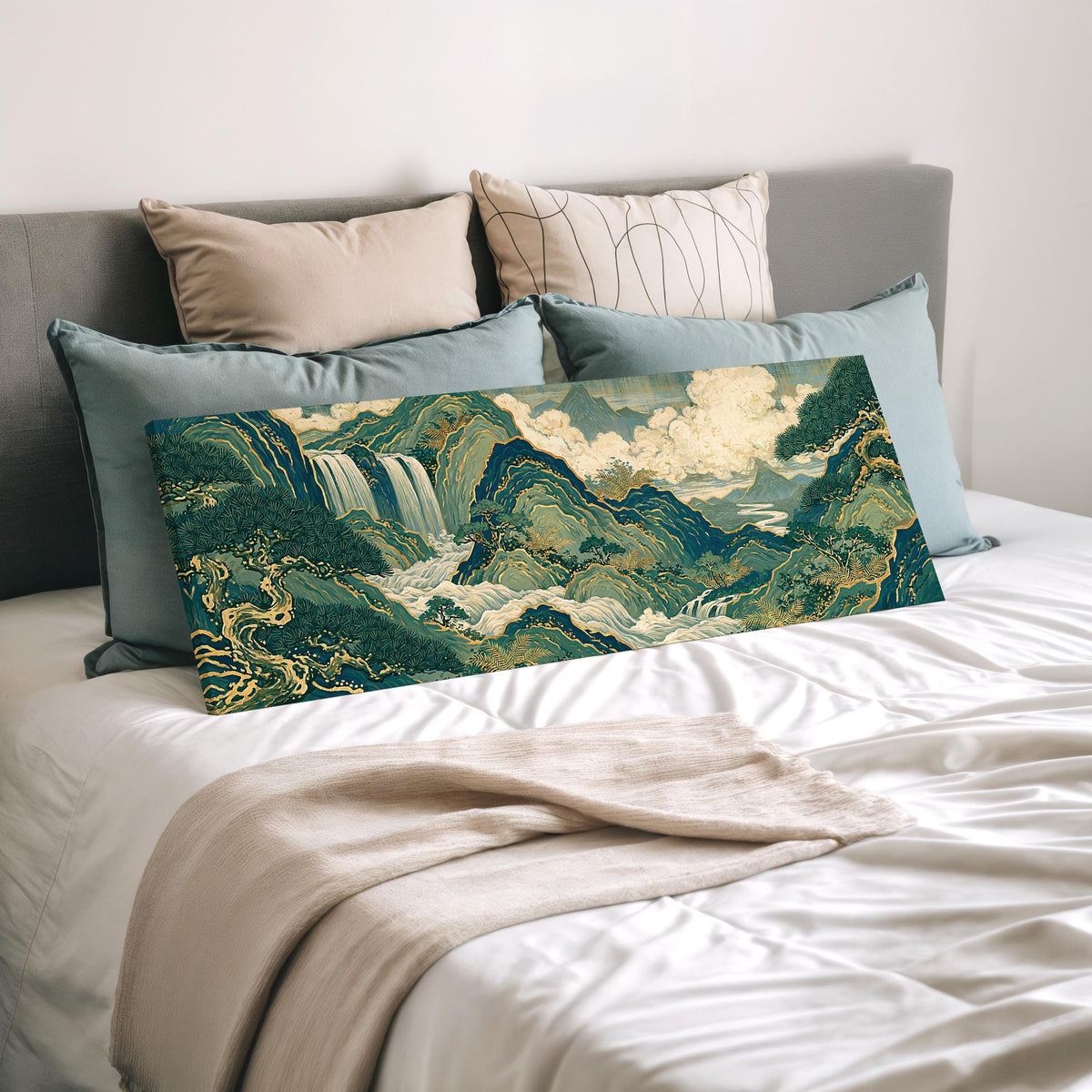Emerald waterfall mountains with gold lines wide panoramic canvas print laid on a bed to show its size