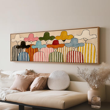 Gathering of figures in straw hats and stripes long horizontal canvas print above a sofa in a living room