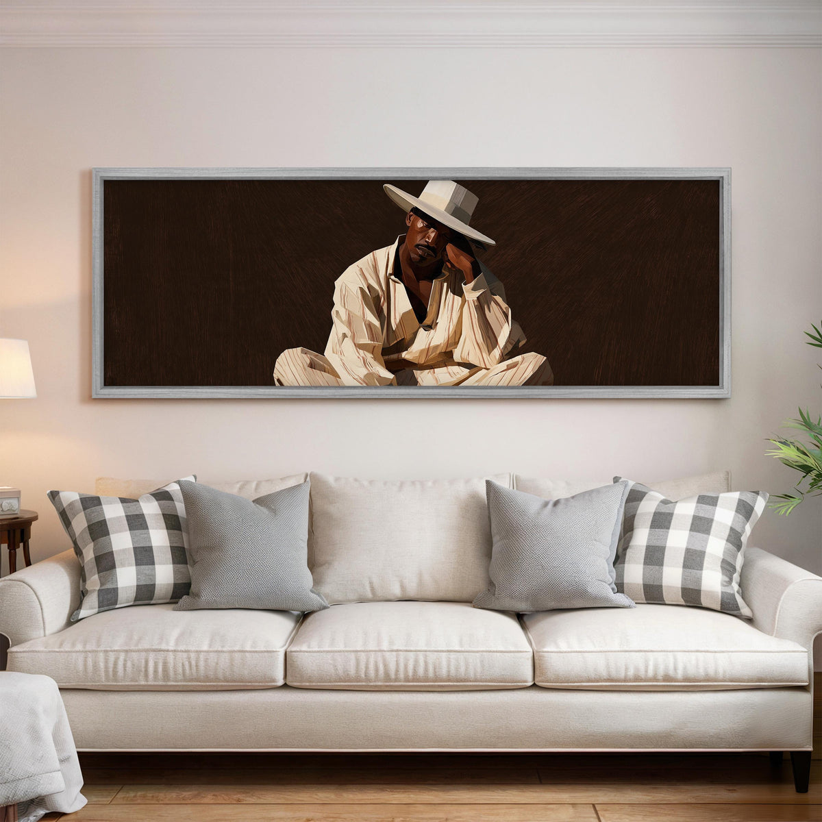 Pensive man in a white hat on brown panoramic canvas print above a white sofa in a bright living room