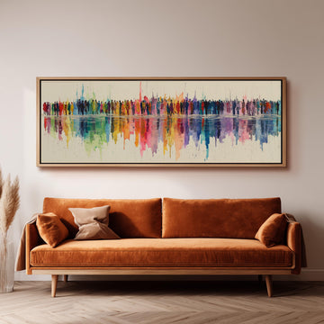 a large, colorful painting of a group of people on a wall above a brown sofa in a living room setting.