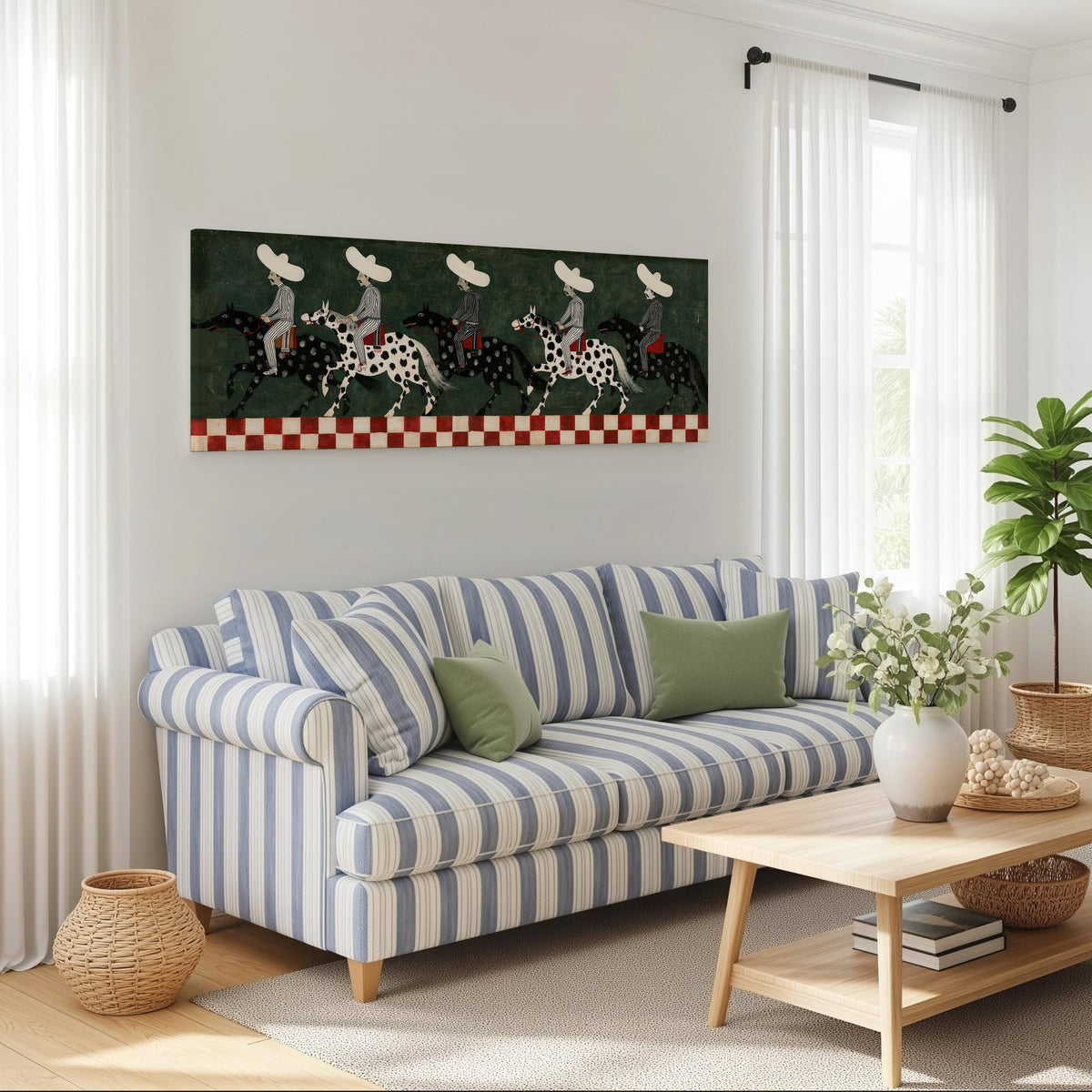 Riders in sombreros on spotted horses long horizontal canvas print above a striped sofa in a coastal living room