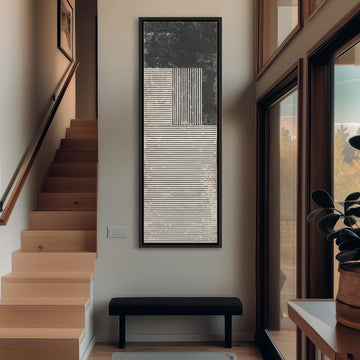 a modern and minimalist interior design, featuring a large abstract painting on the wall, a wooden staircase, a black bench, and a large window that allows natural light to enter the space.