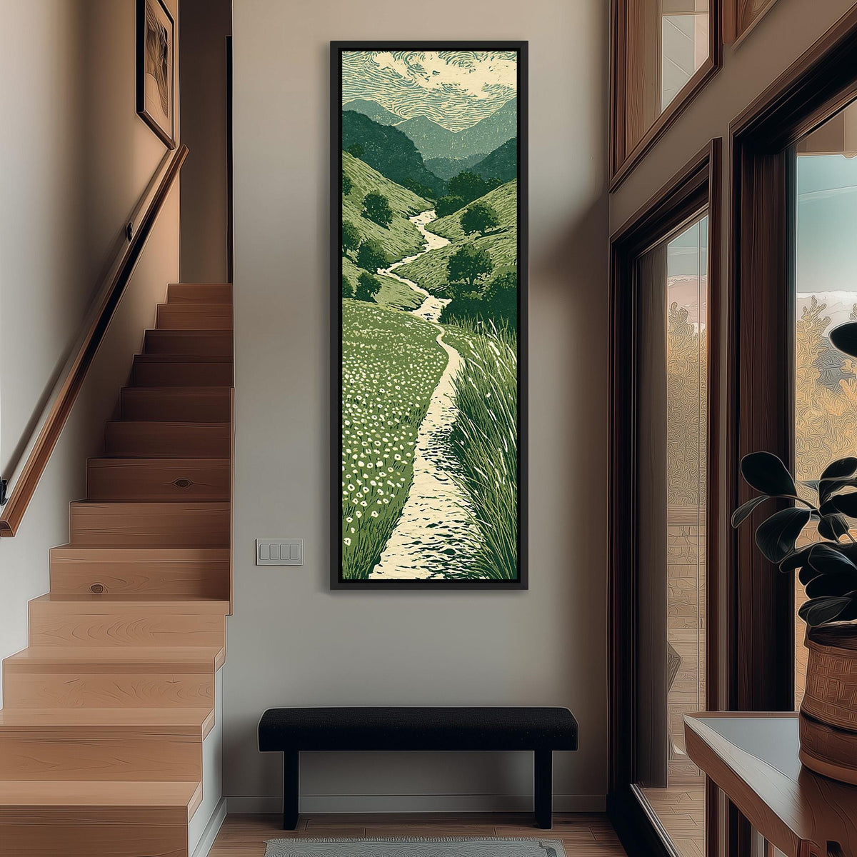 Trail winding through green mountains tall narrow canvas print beside a staircase in an entryway