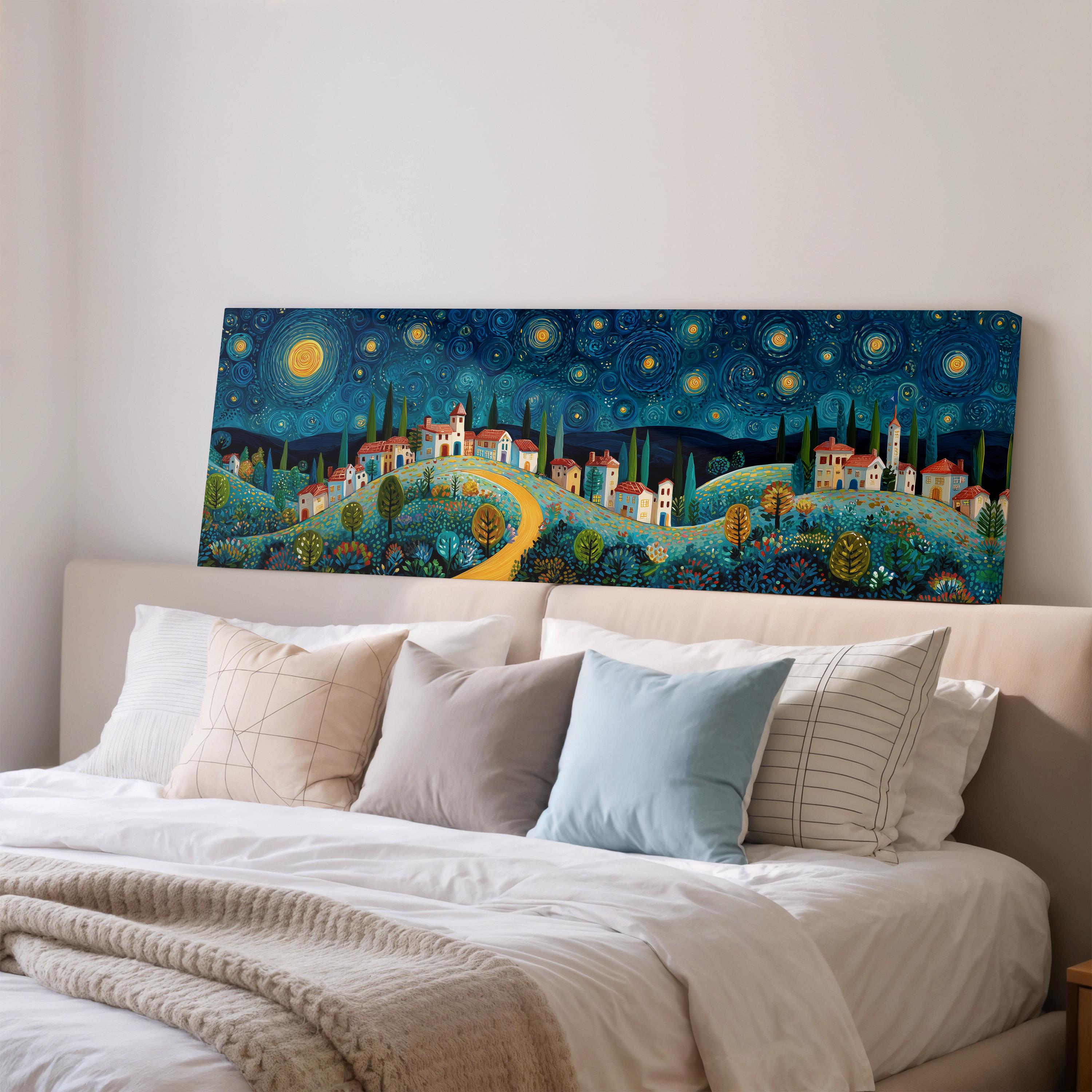 a large, colorful painting of a village landscape hanging on a wall above a bed with white pillows and a gray blanket.