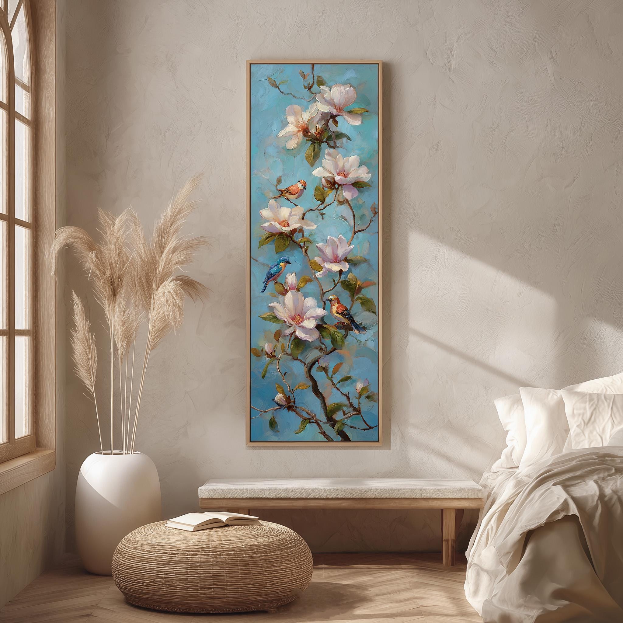 a large painting of flowers hanging on a wall, with a bed and a window in the background.