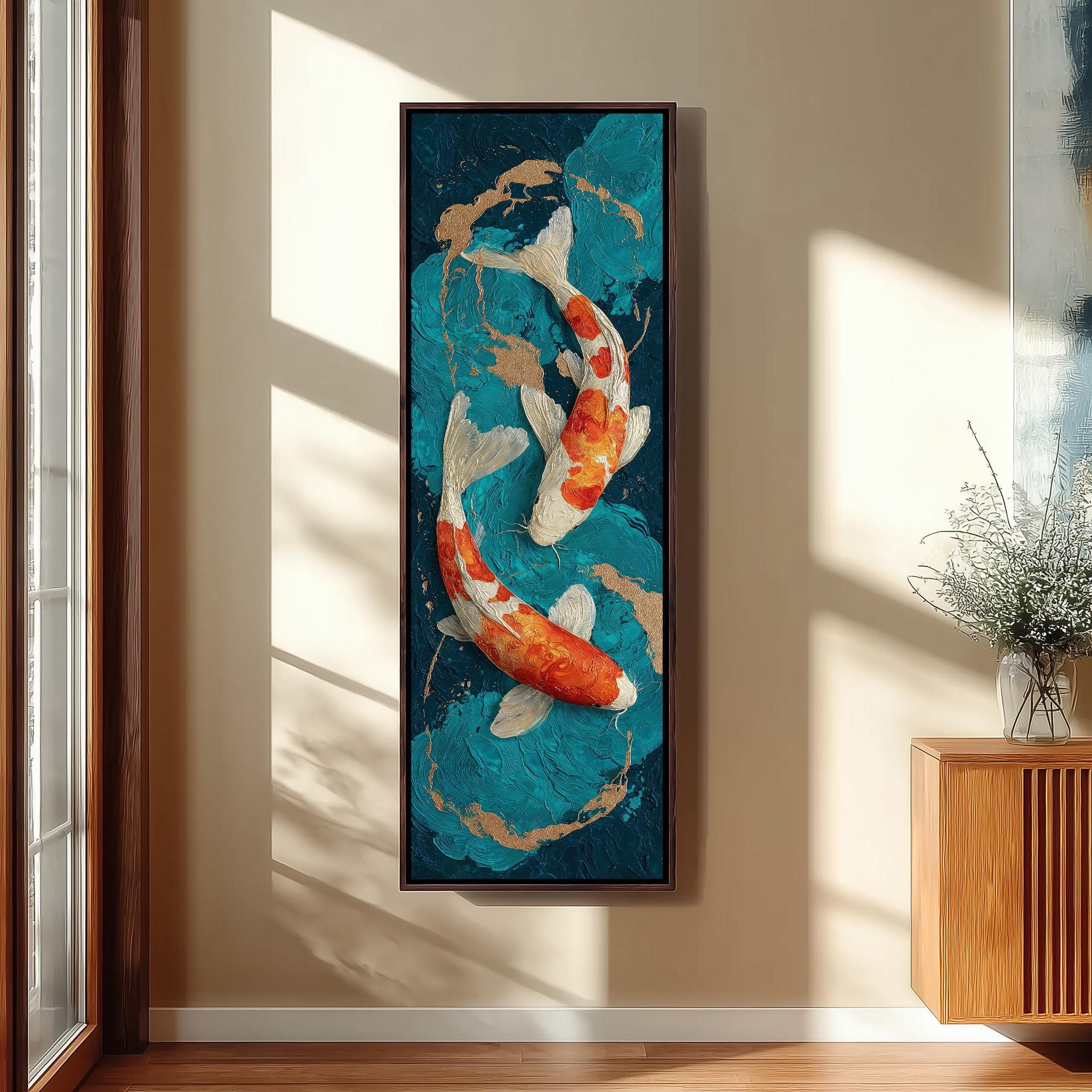 a large framed painting of two koi fish swimming in a blue and green water scene, hanging on a wall in a room with a wooden cabinet and a vase of flowers.