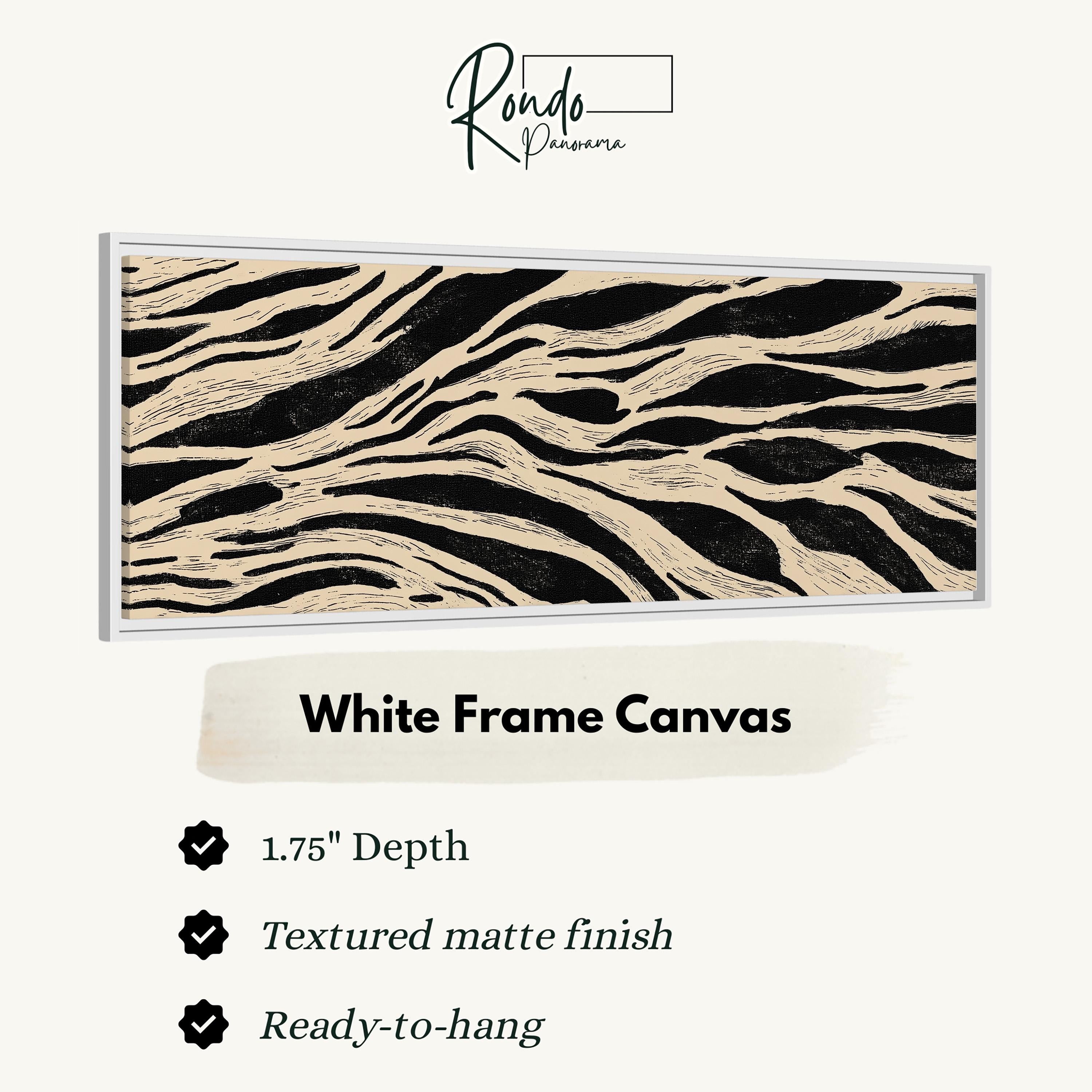 a white frame canvas with a striking black and white zebra print design. The canvas has a 1.75" depth and is textured with a matte finish, making it ready to hang.