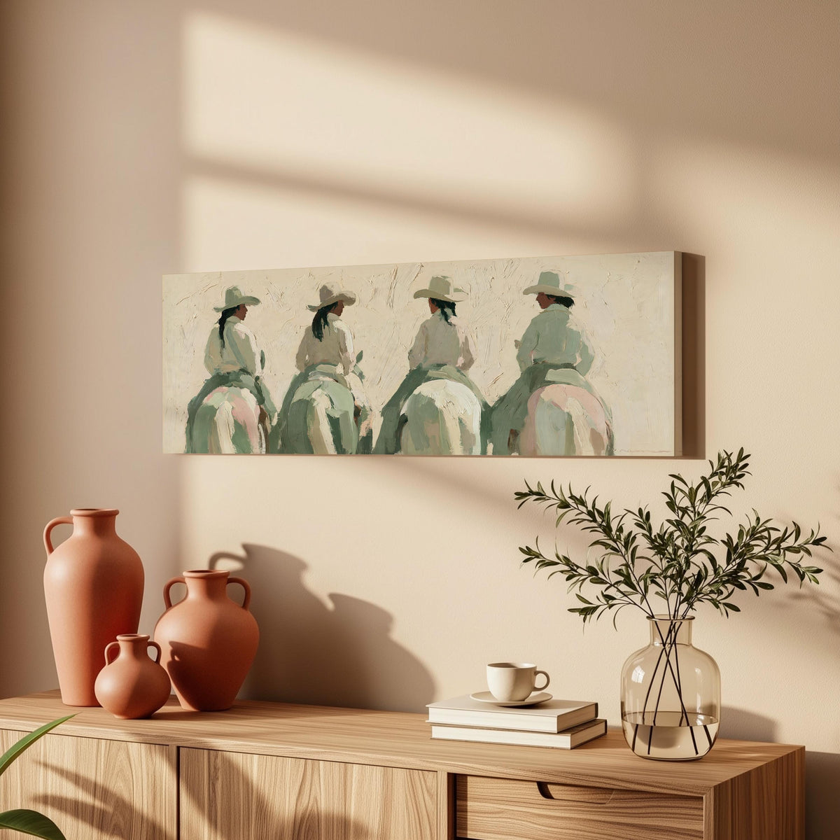 Cowgirl trail riders long horizontal canvas print above a wooden sideboard