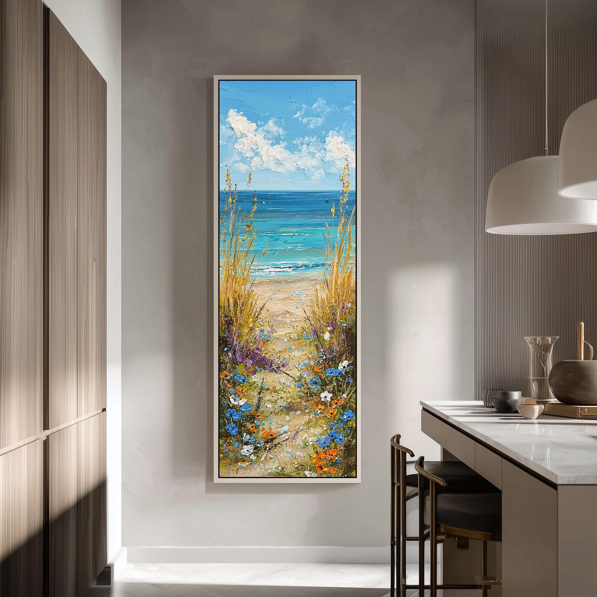 a large painting of a beach scene hanging on a wall, depicting a path leading to the ocean with tall grasses and flowers.