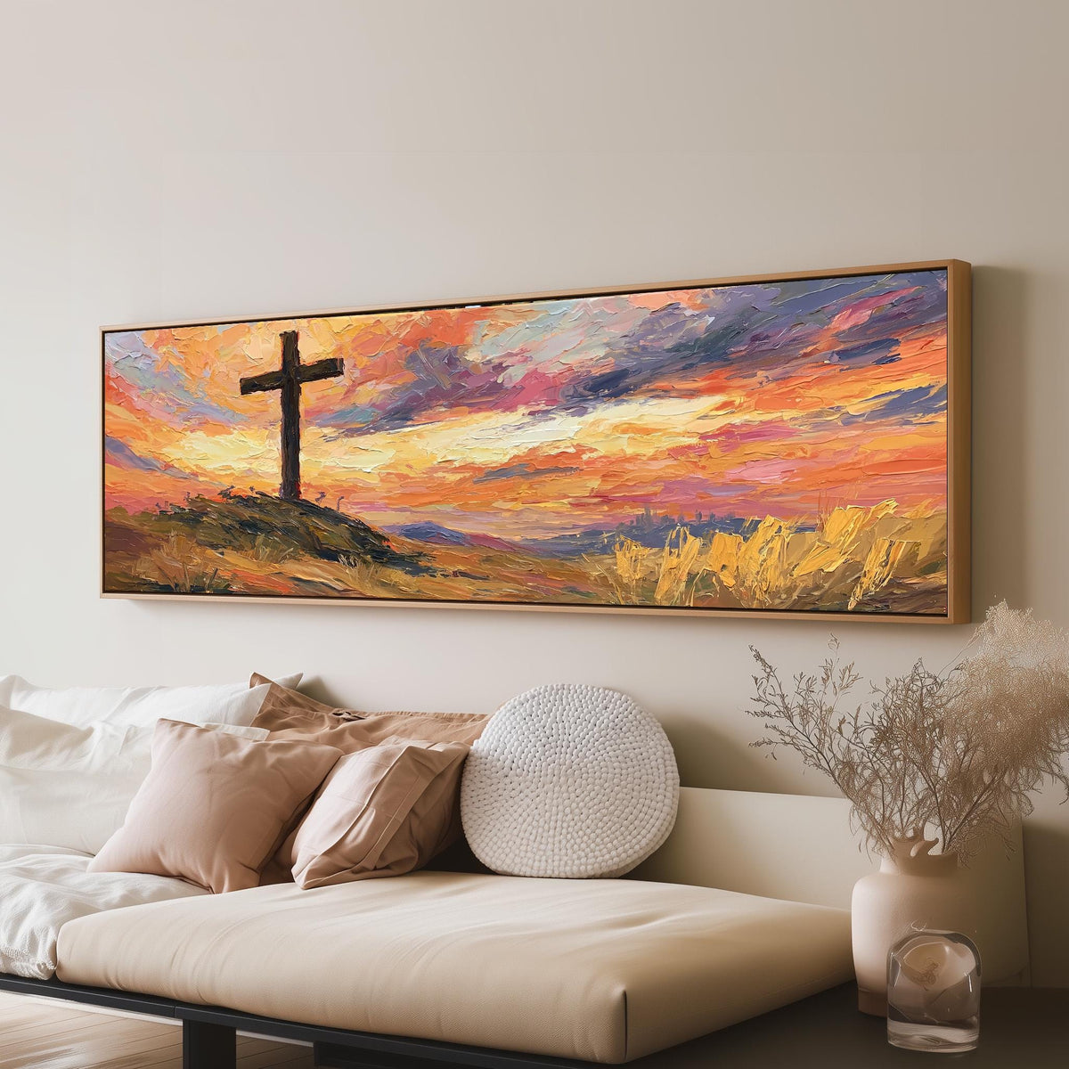 Cross on a hill at sunset long horizontal canvas print above a sofa in a living room