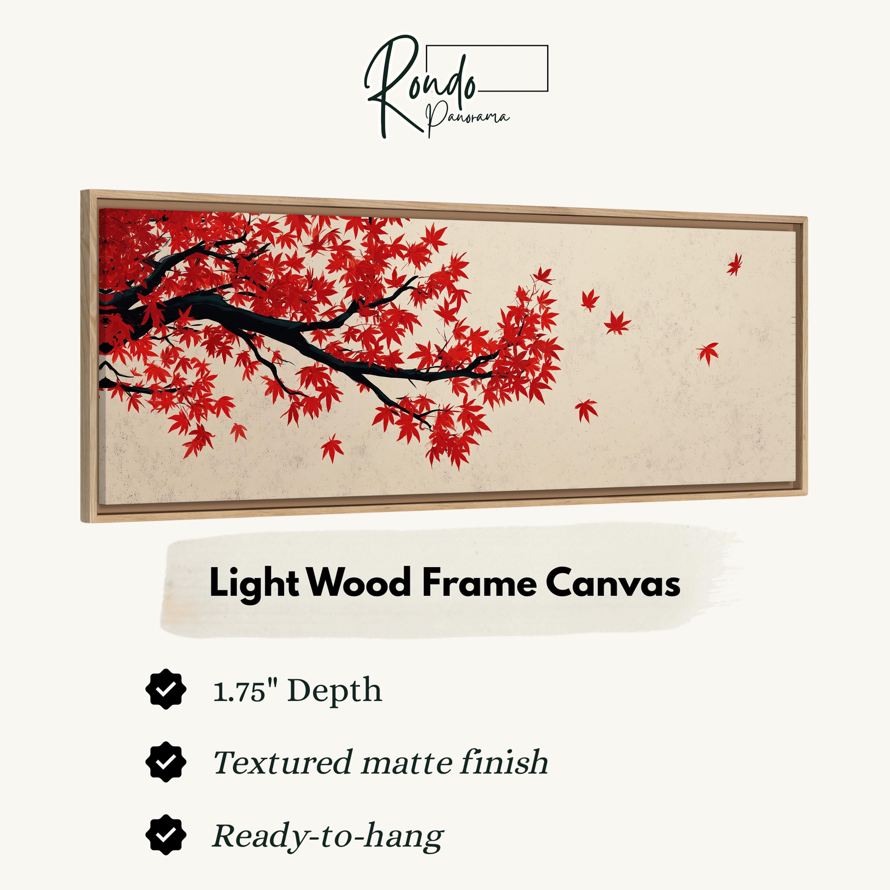 a light wood frame canvas with a painting of a tree with red leaves.