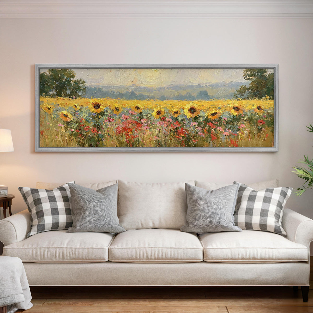 Sunflower and poppy meadow panoramic canvas print above a white sofa in a bright living room
