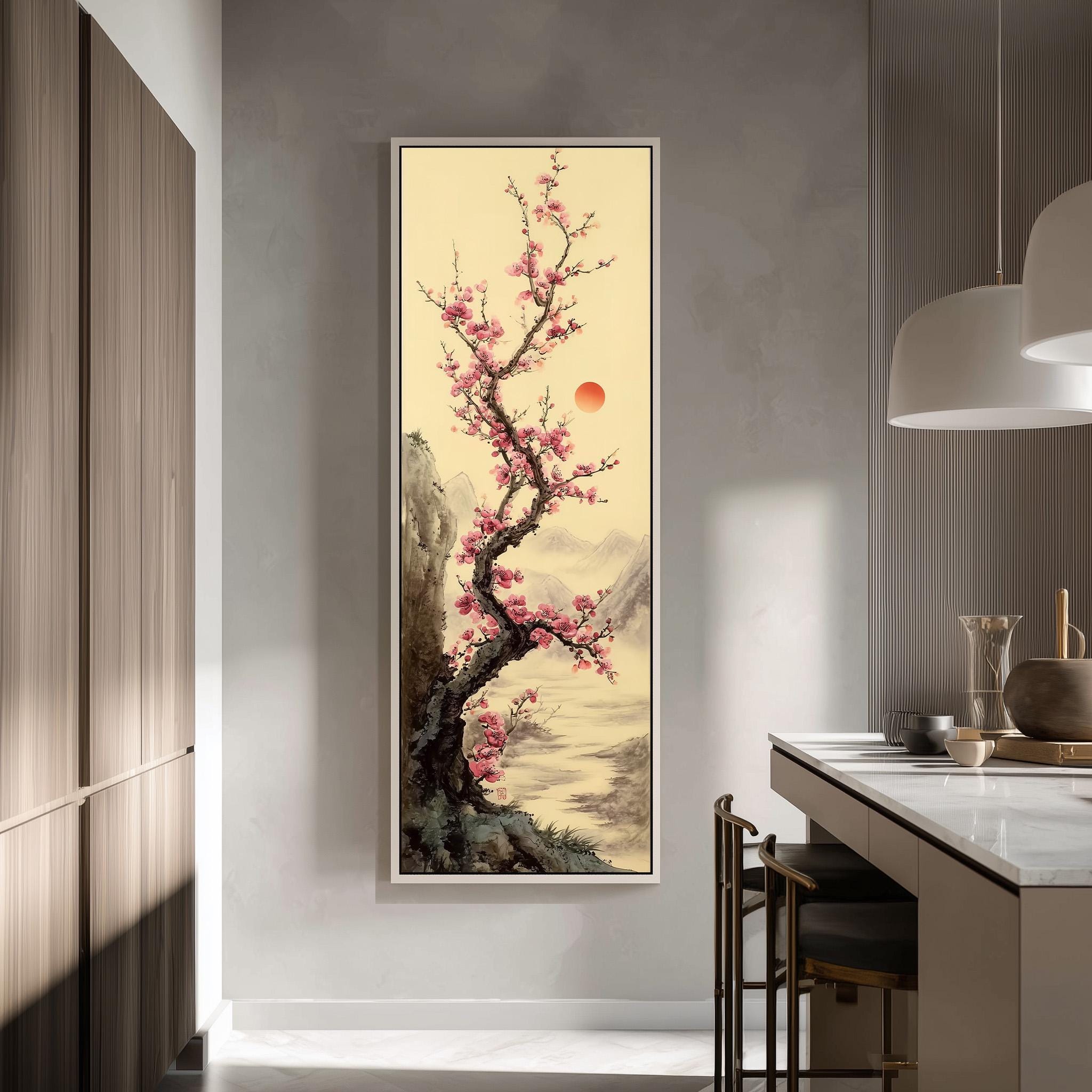 a large, framed painting of a cherry blossom tree with pink flowers, hanging on a wall in a modern kitchen.