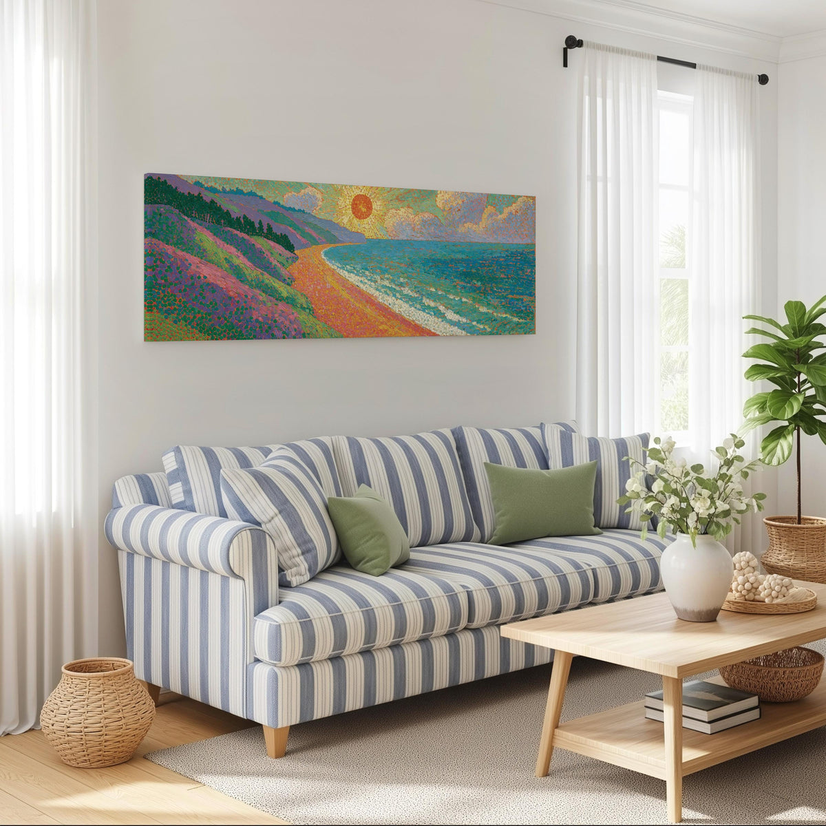 Coastal cliffs at sunset long horizontal canvas print above a striped sofa in a coastal living room