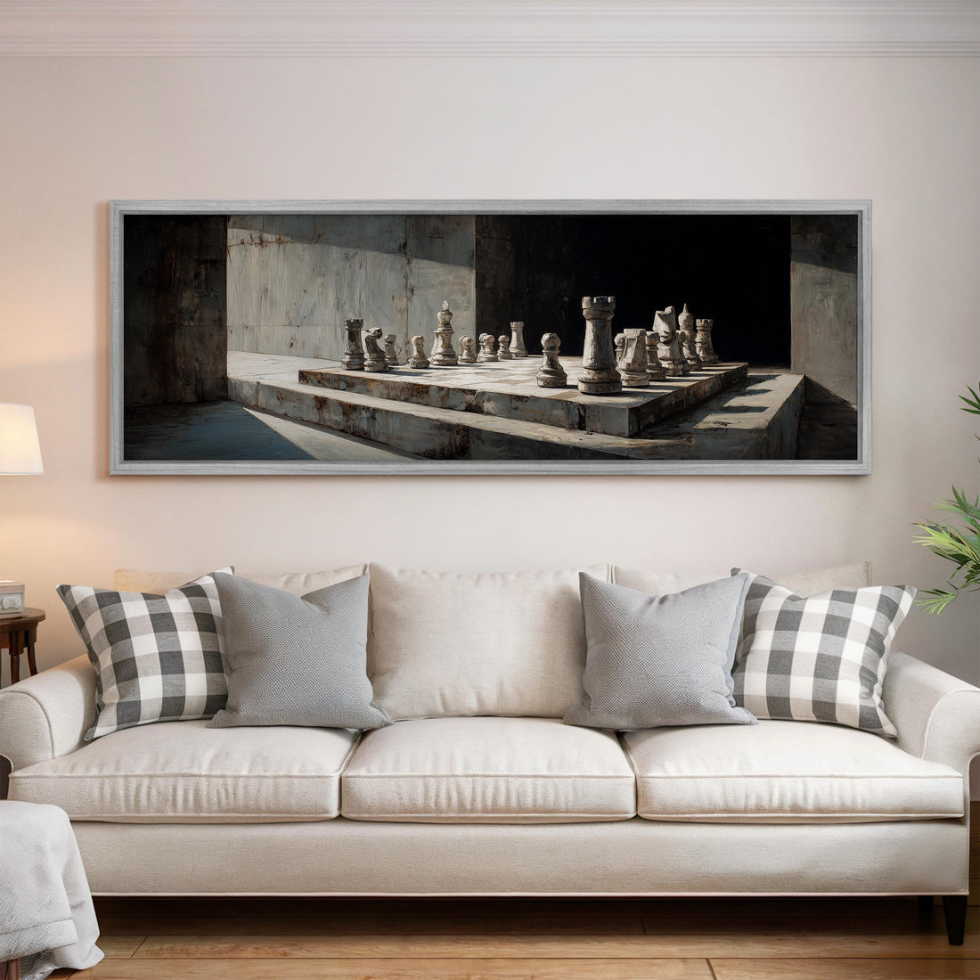 a black and white checkered sofa with a brown throw pillow, positioned in front of a large framed painting depicting a chessboard with chess pieces.