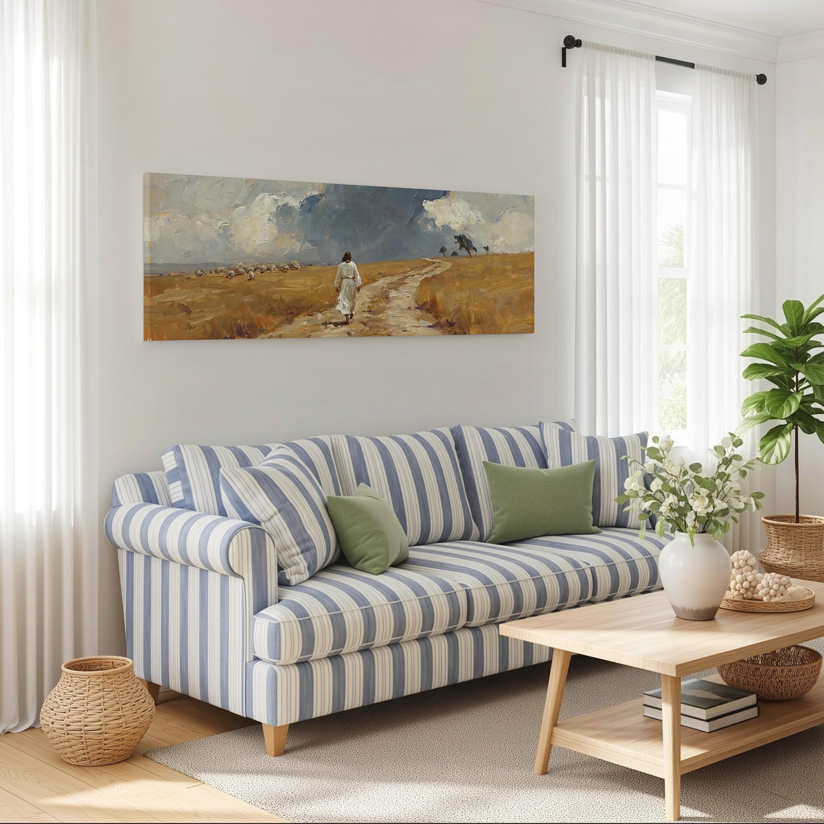 Jesus walking a field path with grazing sheep long horizontal canvas print above a striped sofa in a coastal living room