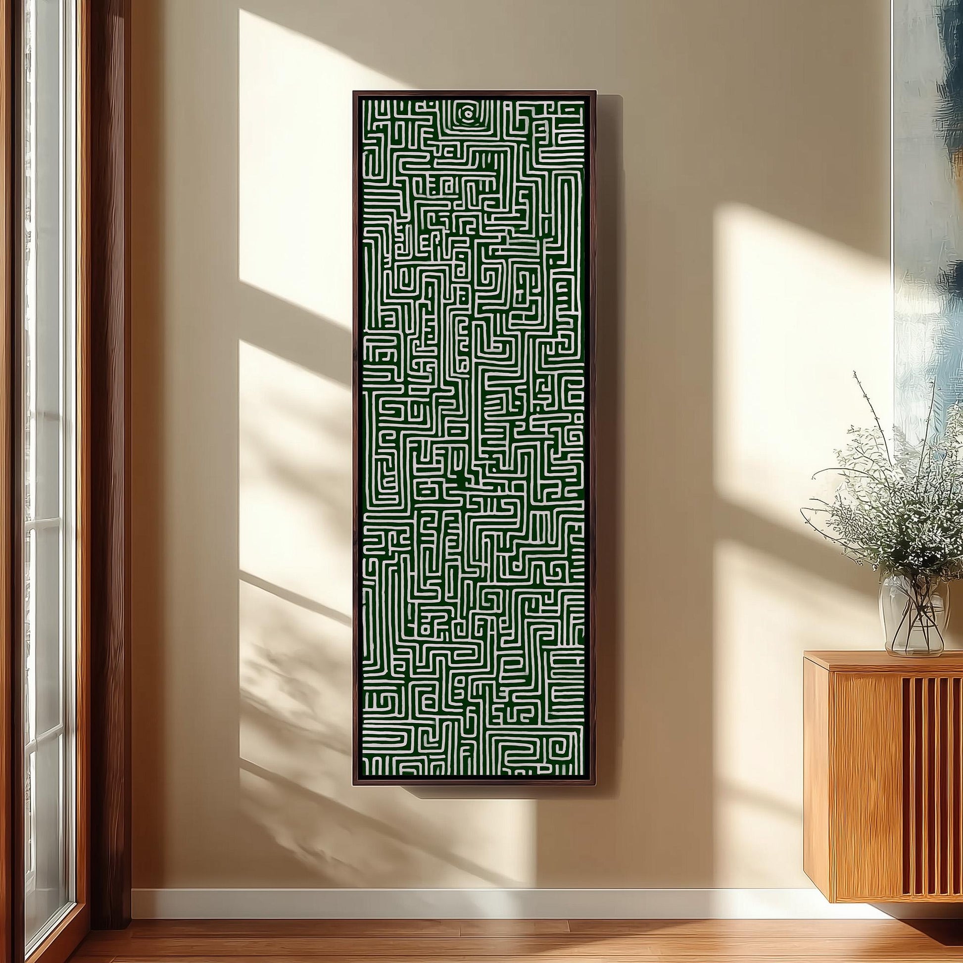 a large, abstract painting hanging on a wall in a room with a wooden floor and a window.