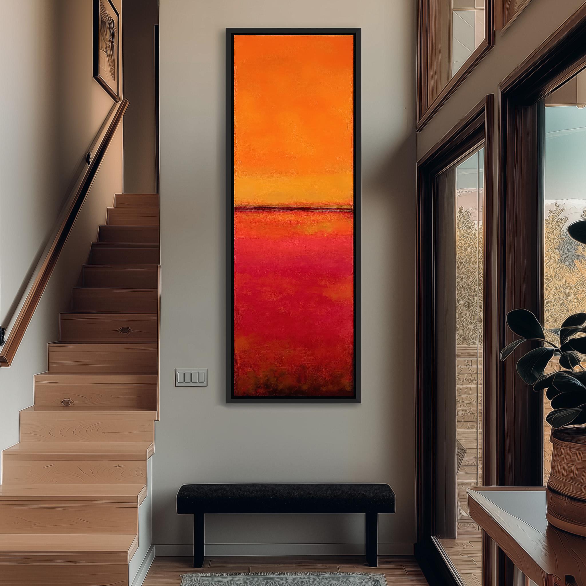 a modern hallway with a large, vibrant painting hanging on the wall. The painting has a warm, orange and red color scheme, creating a striking focal point in the space. The hallway is well-lit, with natural light coming in through the windows, and a black bench is placed in the foreground. The overall design and decor of the hallway give it a contemporary and stylish appearance.