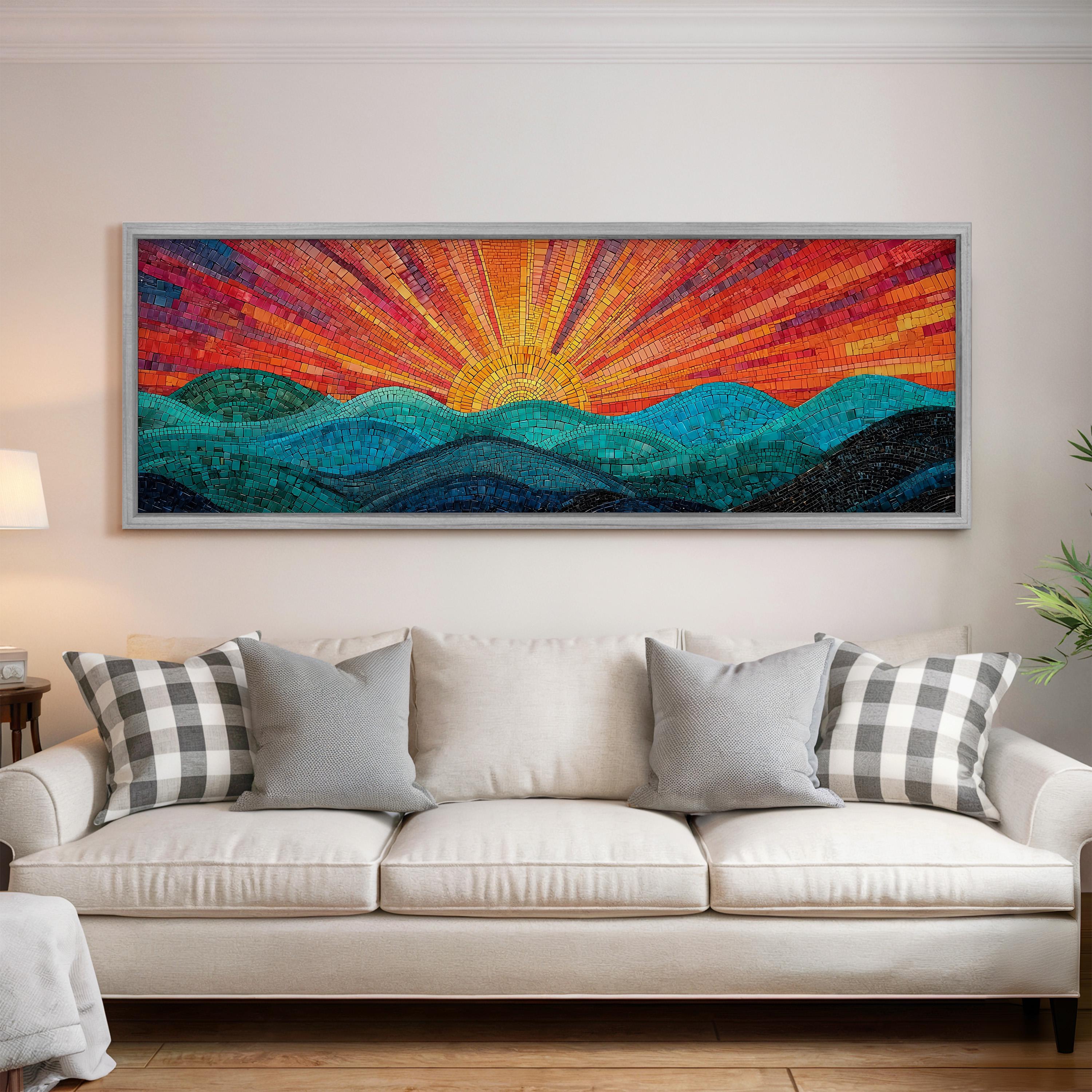 a large, colorful mosaic artwork depicting a sunrise over a mountain landscape, hanging on a wall above a white couch with patterned throw pillows.