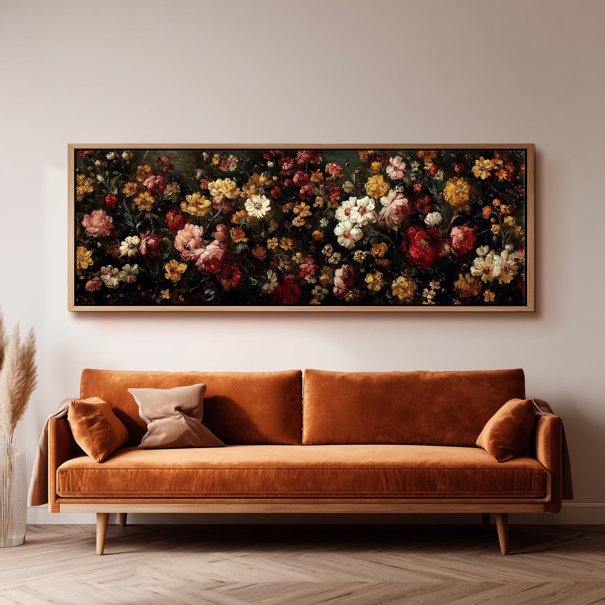 a large, ornate painting of a flower arrangement hanging on a wall above a brown sofa.