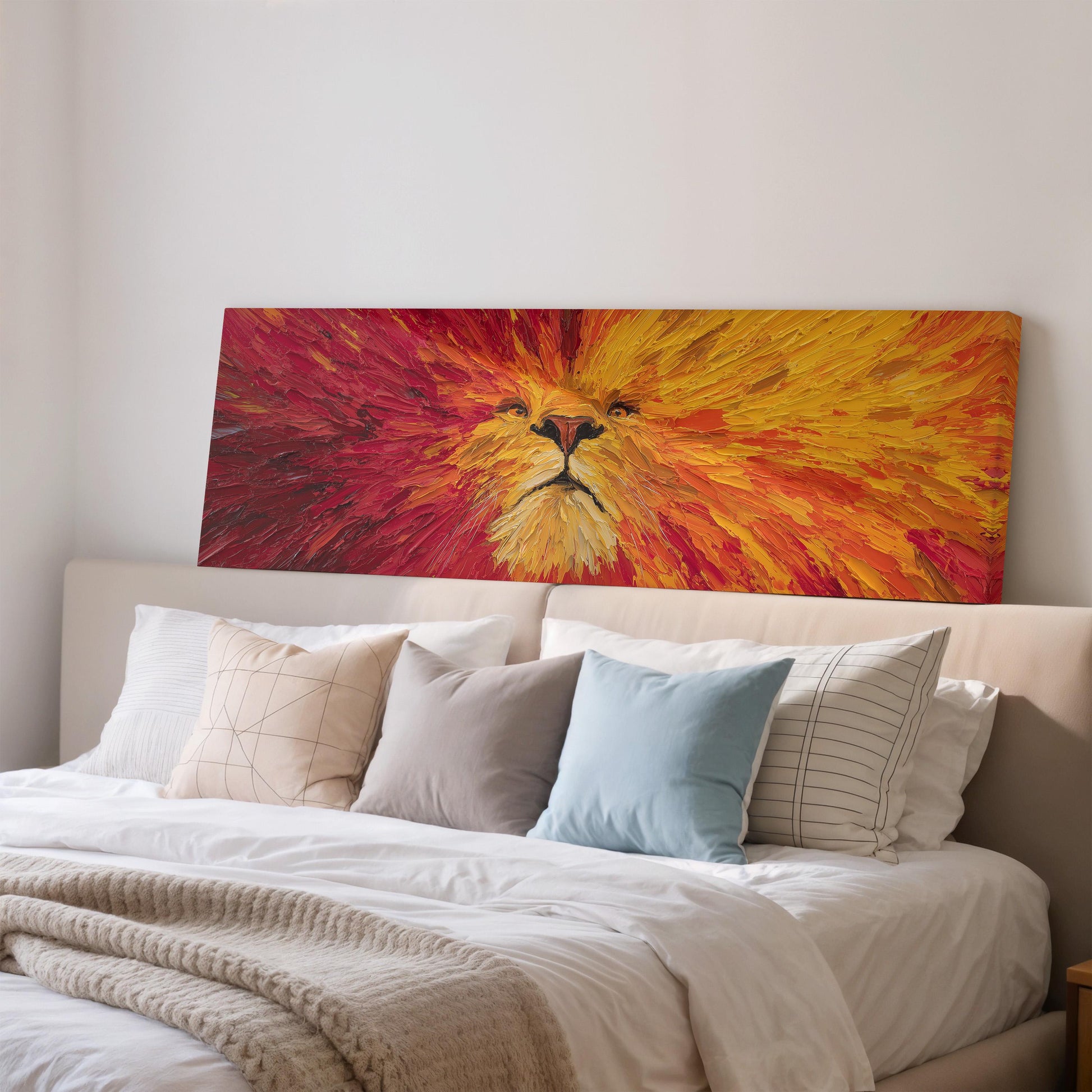 a large, vibrant painting of a lion's face on the wall above a bed with white bedding and pillows.