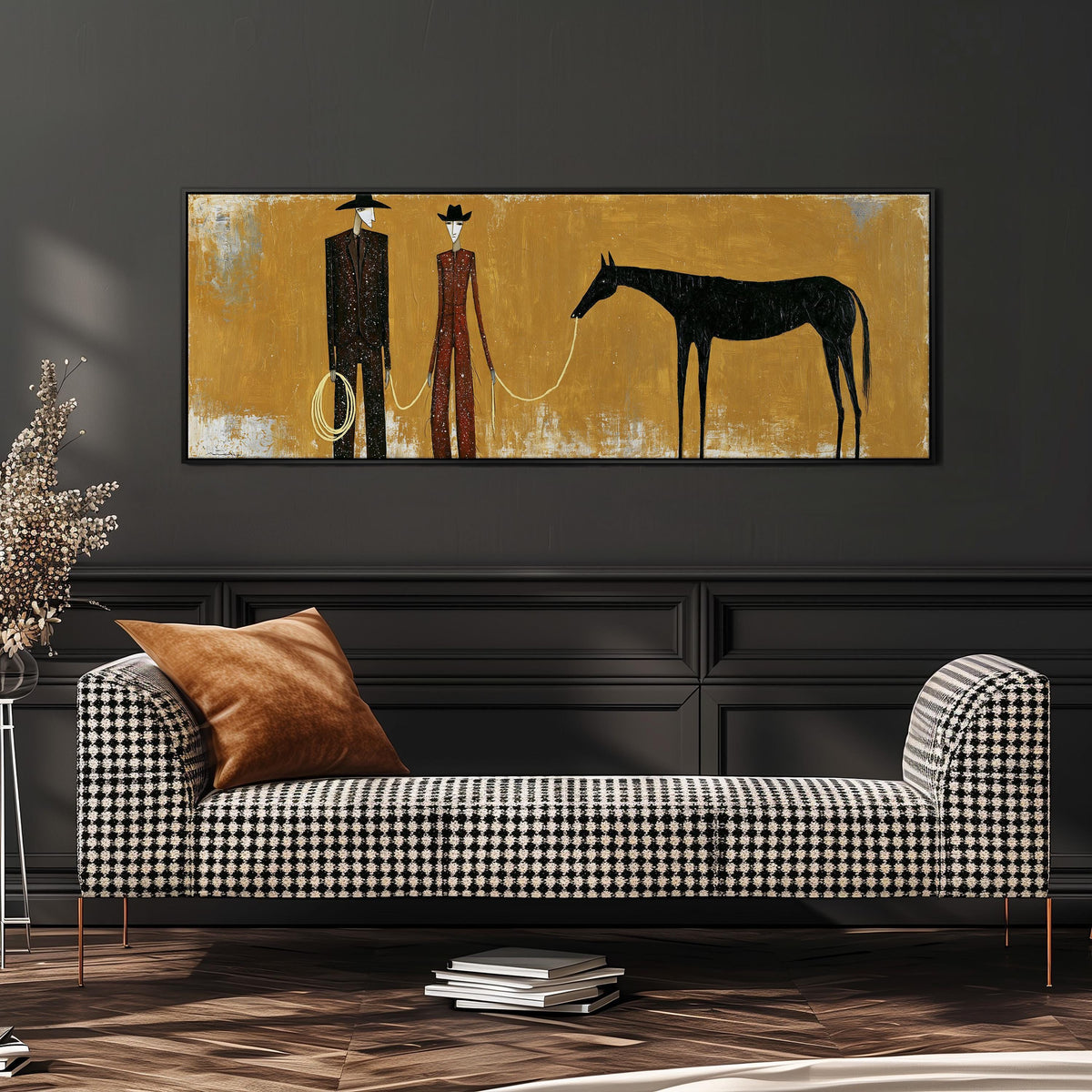 Two cowboys with a dark horse on gold wide panoramic canvas print above a bench in a dark living room