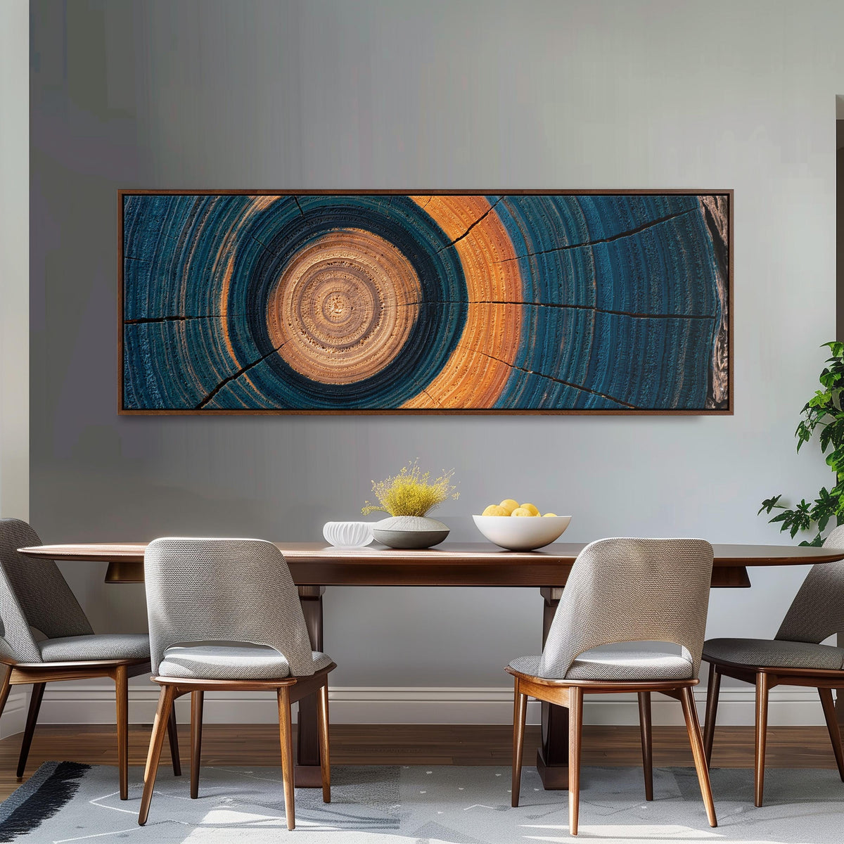 Teal and orange tree ring long horizontal canvas print above a dining table