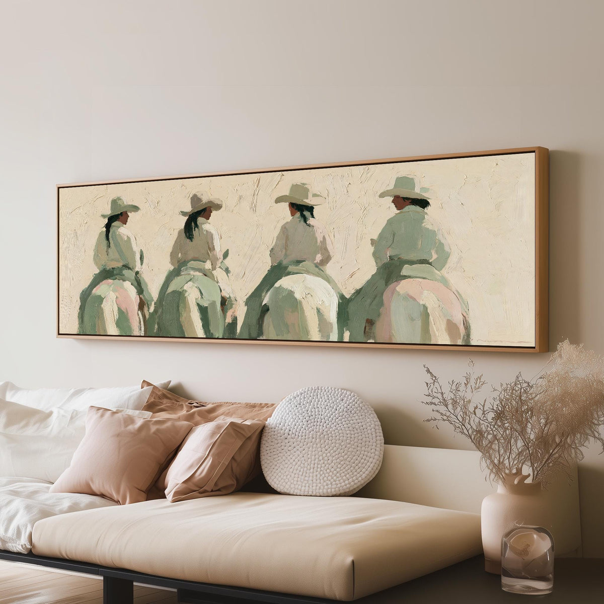 Cowgirl trail riders panoramic canvas print above a sofa in a living room