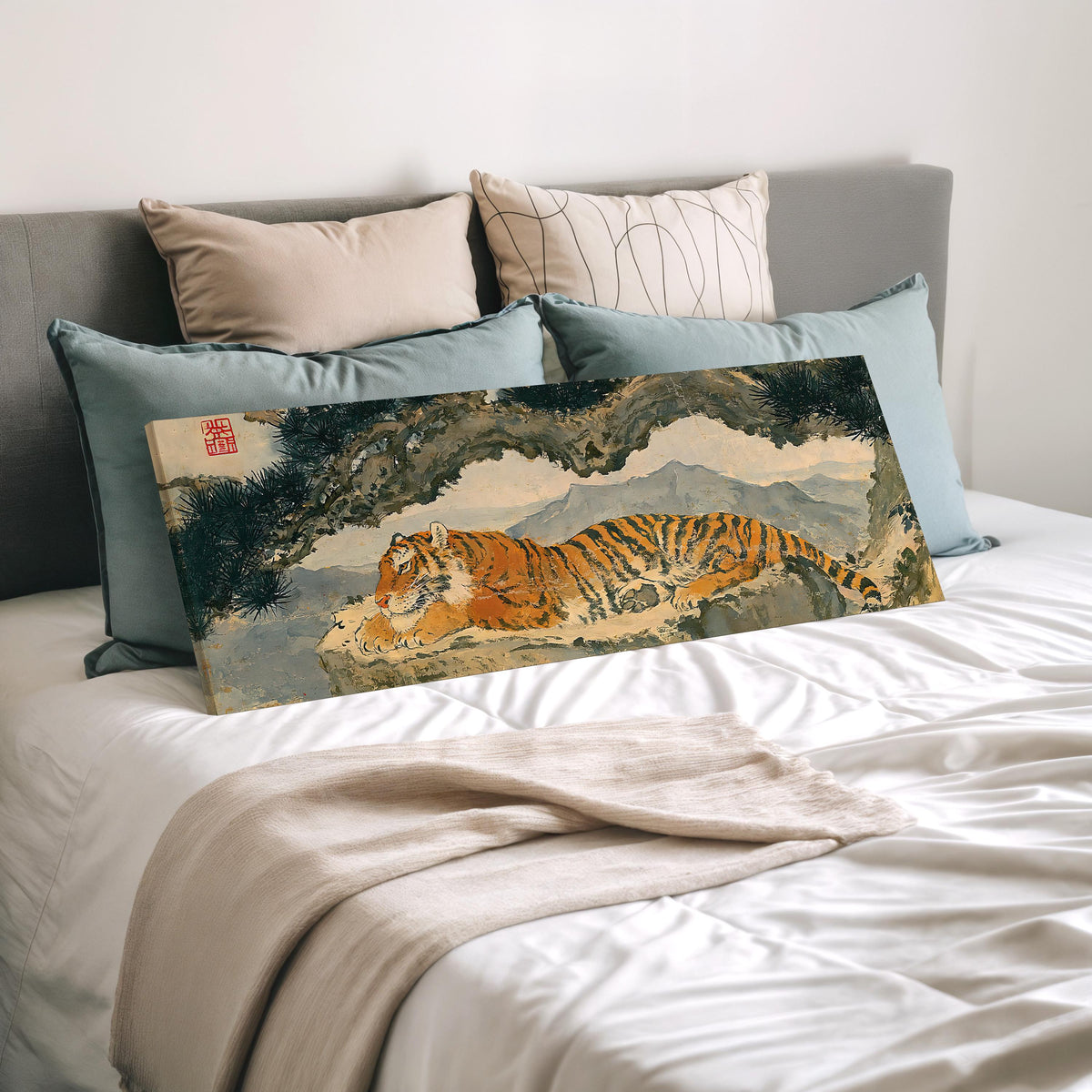 Tiger resting beneath misty pines wide panoramic canvas print laid on a bed to show its size