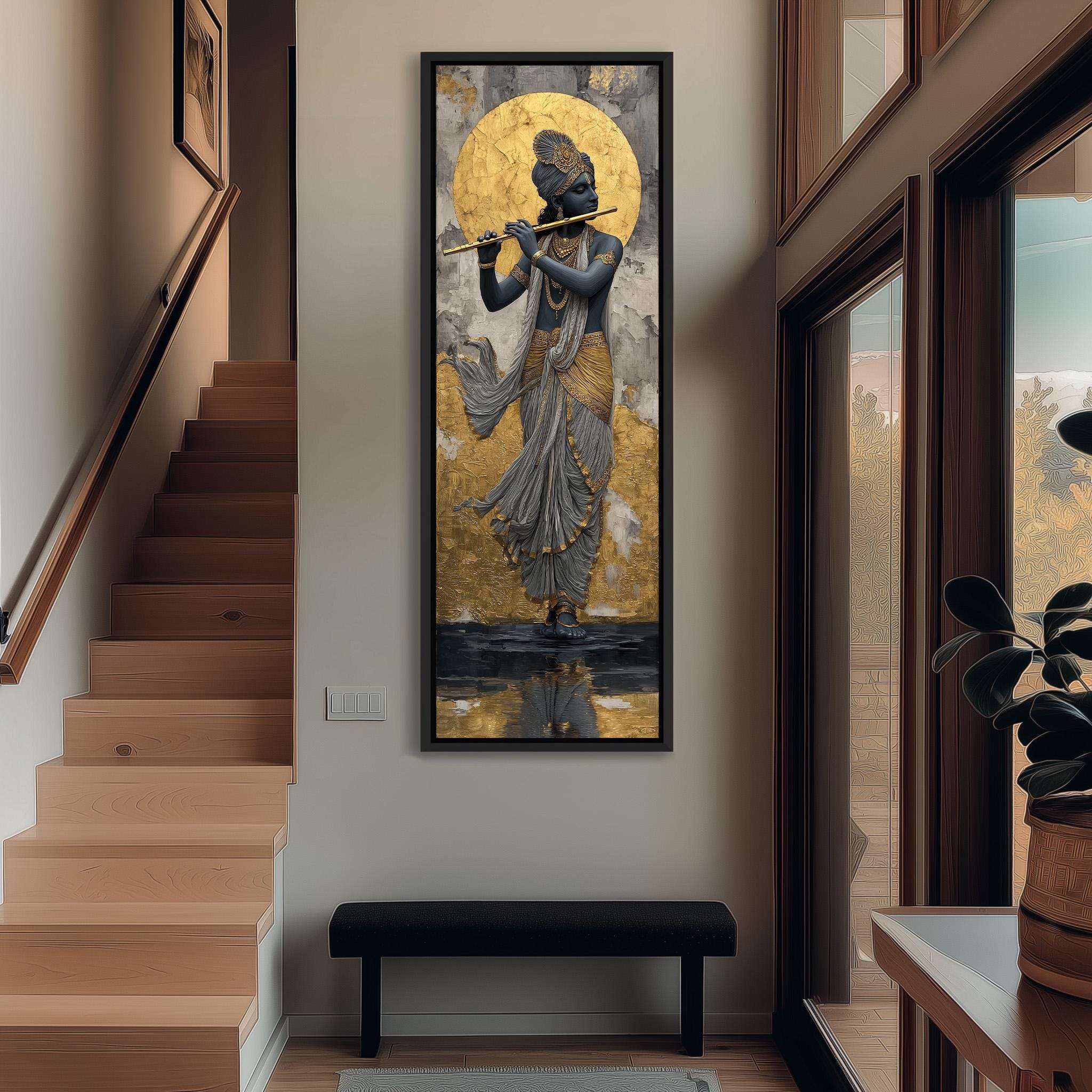 a large painting of a deity, possibly a Hindu deity, hanging on the wall of a room with a wooden staircase and a bench below.
