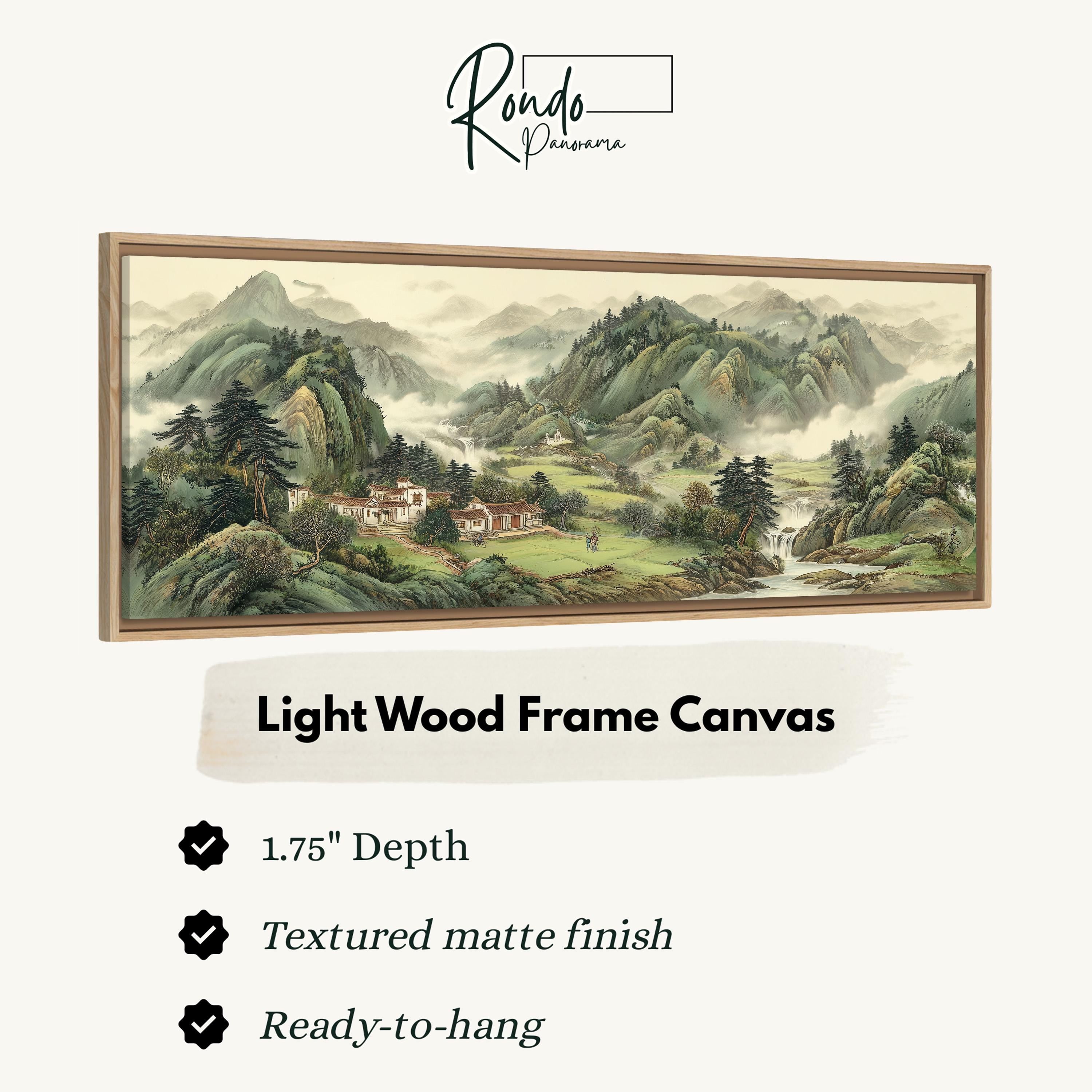 The image is a framed landscape painting depicting a serene mountain scene with a village nestled in the valley below.